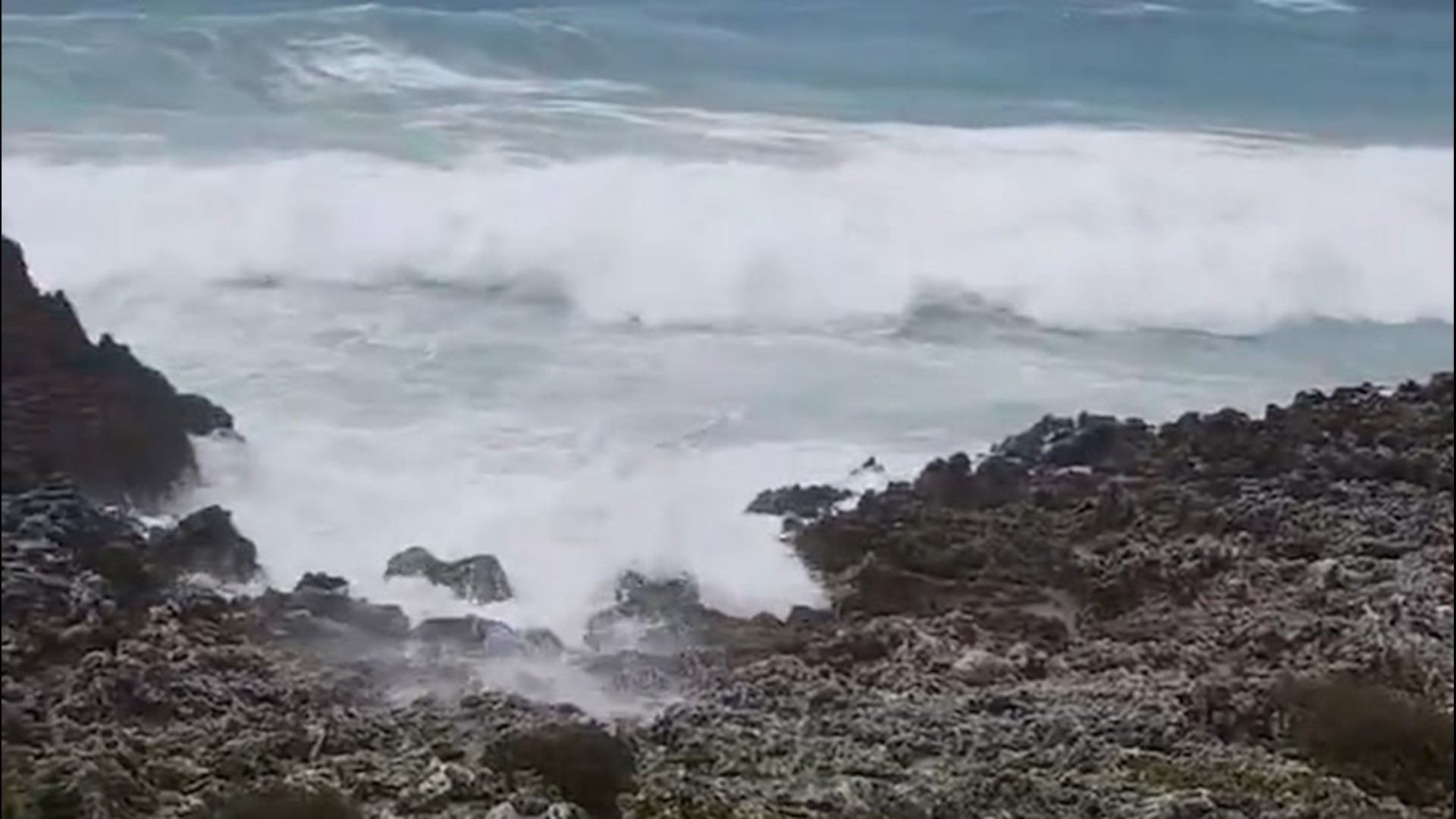 Storm surge churned by Hurricane Delta causes water to encroach on the shores of the Cayman Islands on Oct. 6.