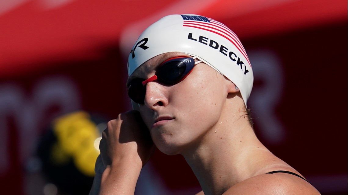 Why do Olympic swimmers wear two swim caps?