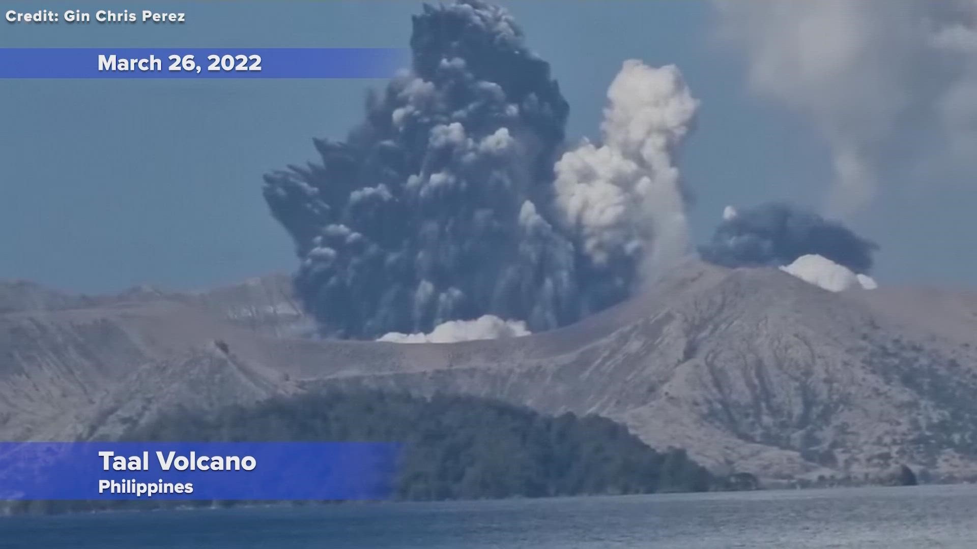 A small volcano in a scenic lake near the Philippine capital belched a white plume of steam and ash a mile into the sky in a brief explosion on Saturday.