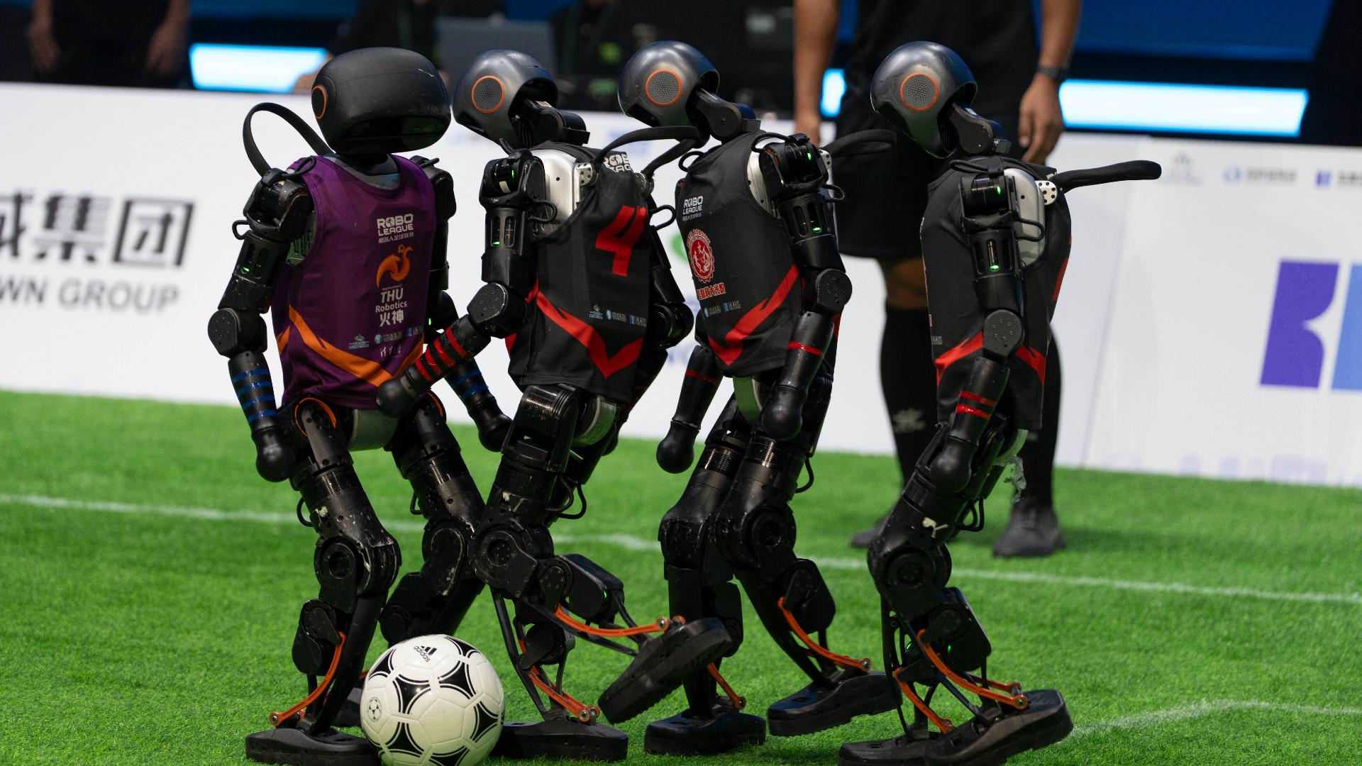 Four teams of humanoid robots faced off in a fully autonomous 3-on-3 soccer match powered entirely by artificial intelligence in Beijing on Saturday night.