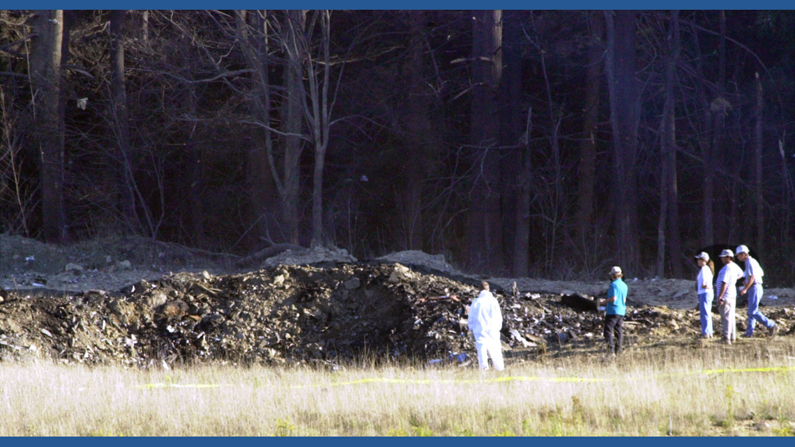 UN —under nest— Aerial footage shows a crater in the ground by the crash of United