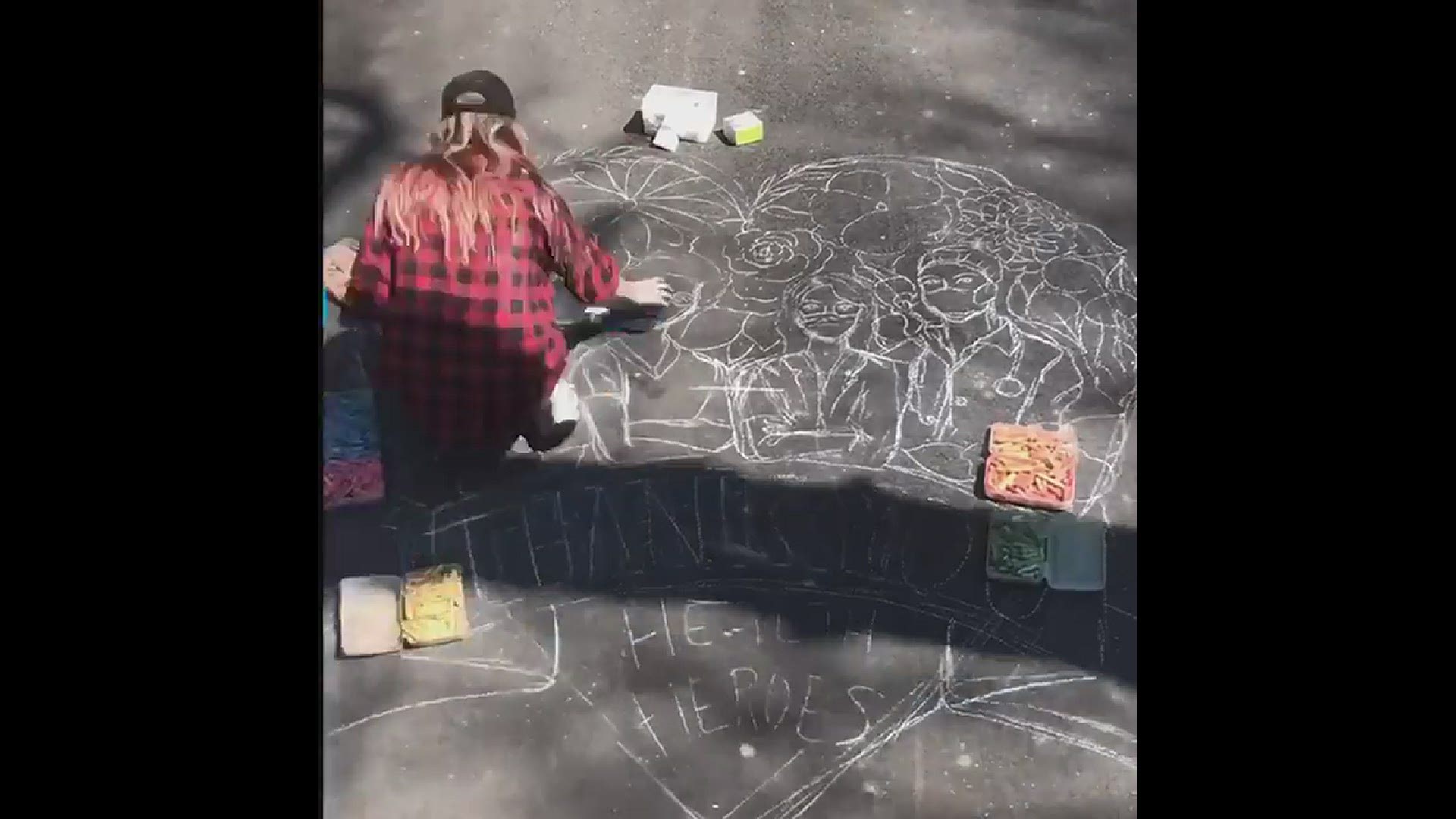 Watch artist Kara Hoblin transform her driveway into a work of art thanking medical workers.