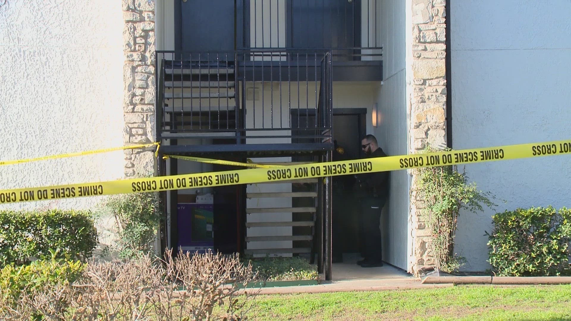 Man covered in blood found outside apartment where woman was shot and