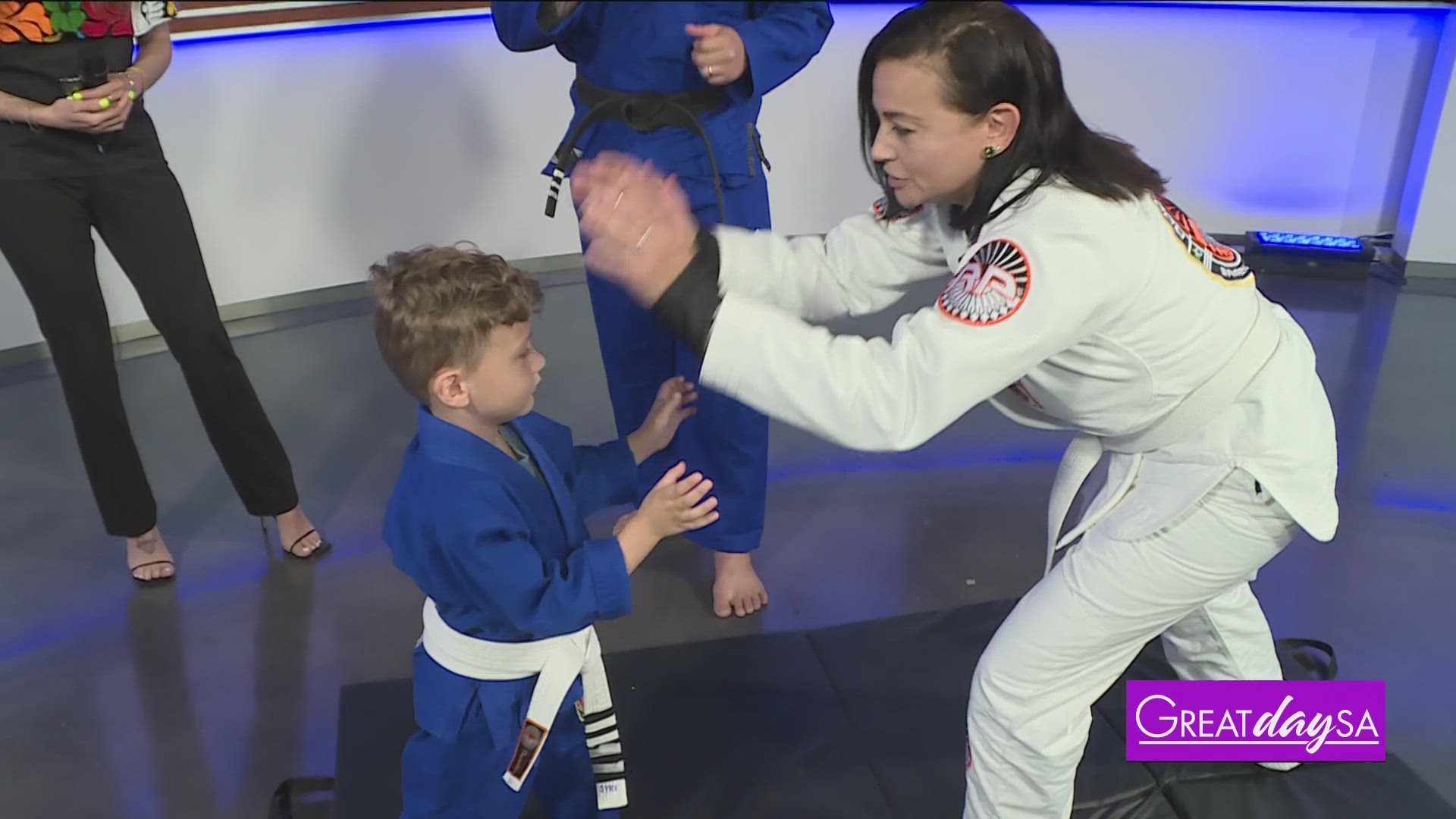 Roma learns some moves from Professor Riba at Rodrigo Pinheiro Brazilian Jiu Jitsu.