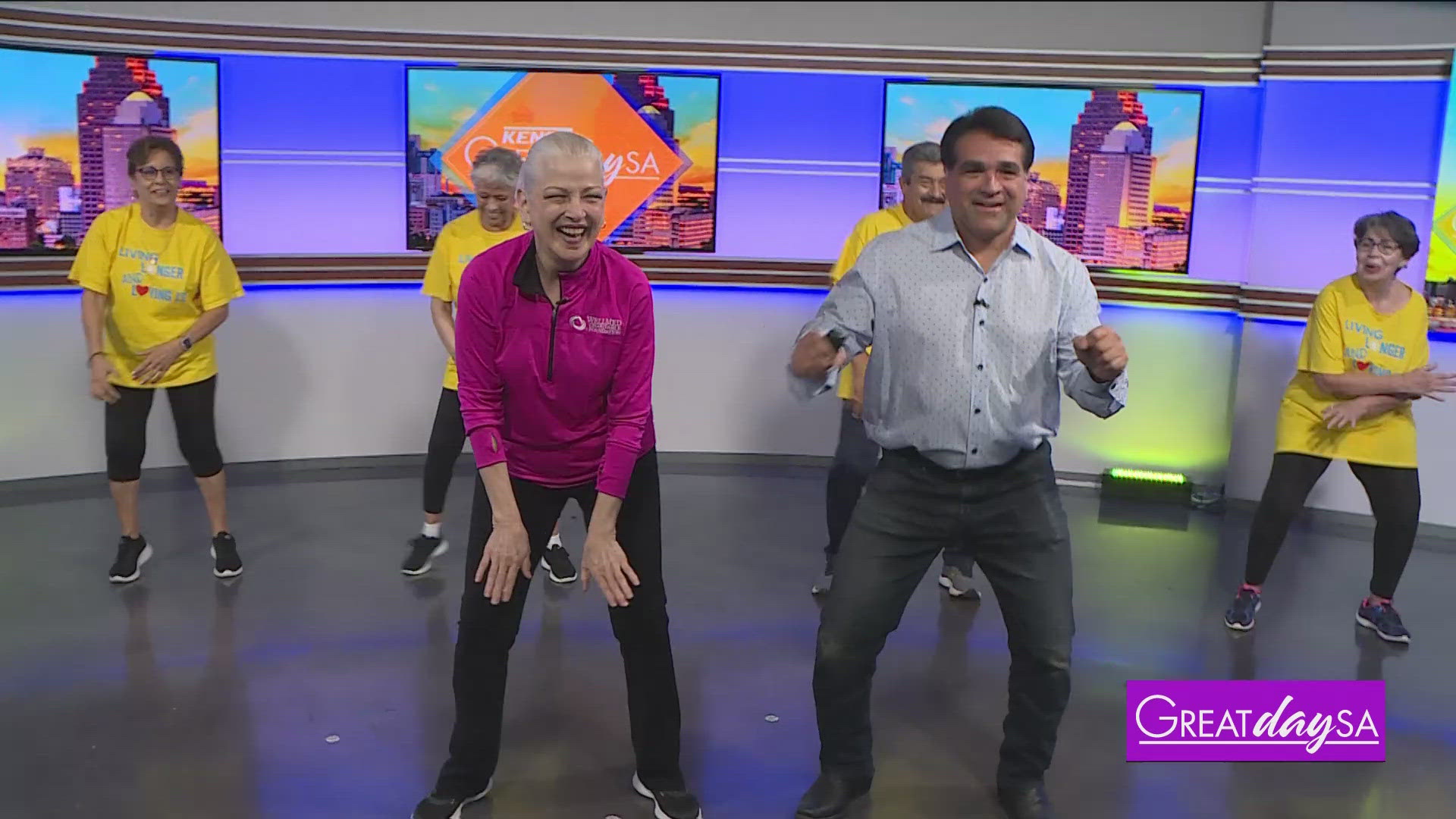 Paul gets an aerobics lesson from Peaches Hall & friends with the Doris Griffin Senior Activity Center.