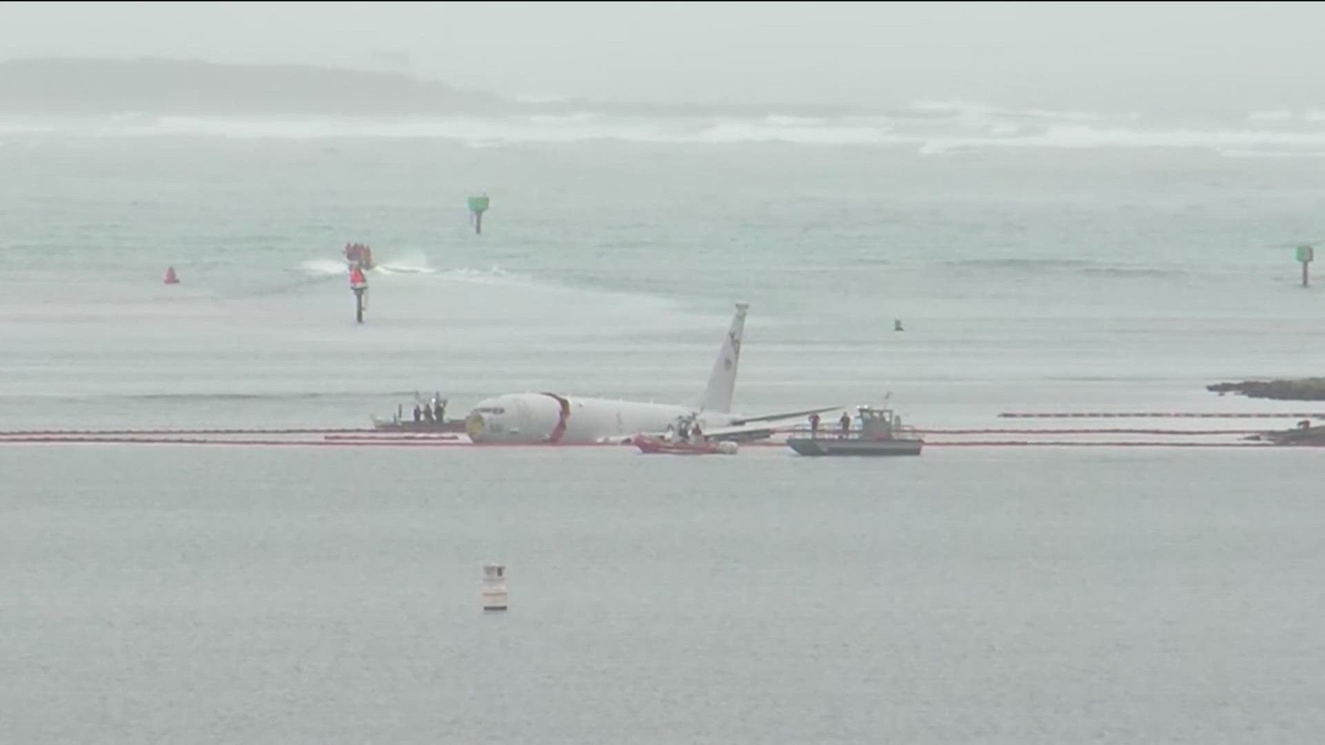 Officials say the aircraft overshot its landing at the Marine base on Oahu, ending up in the Bay at the end of the runway.