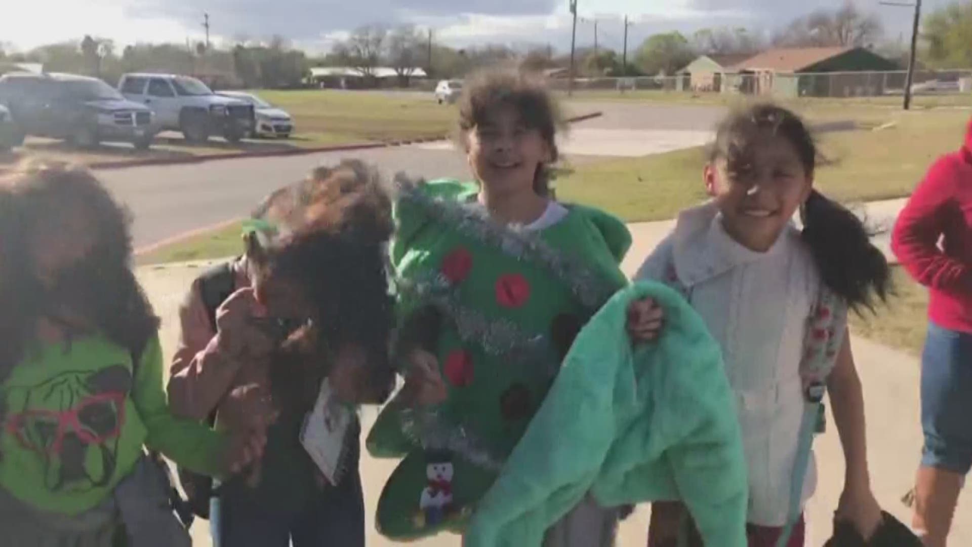 Wind gusts in the Texas town reached 71 mph Thursday, and some young school children had trouble staying upright in it!