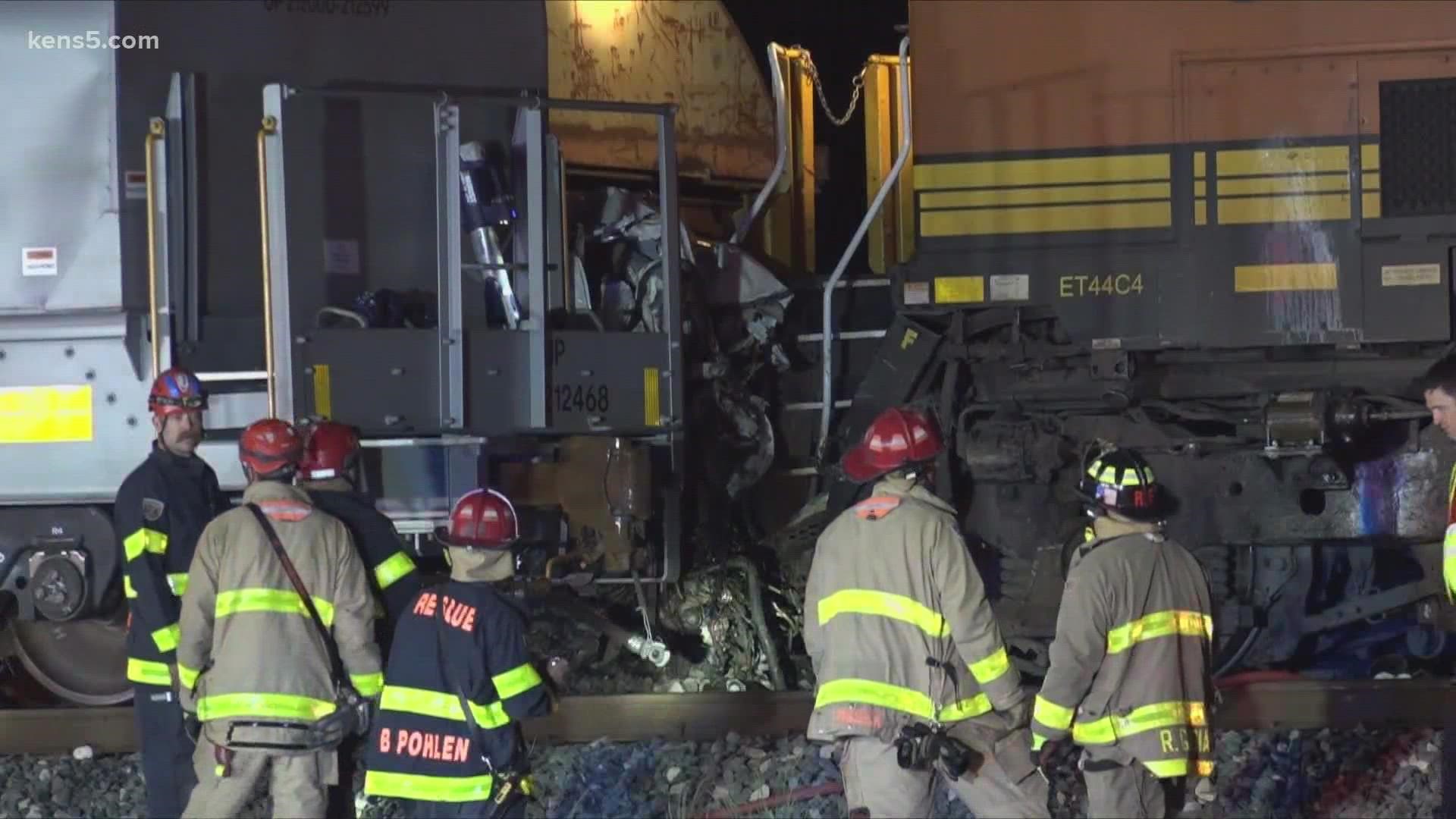 The San Antonio Fire Department spent hours pulling the truck from between the two trains.