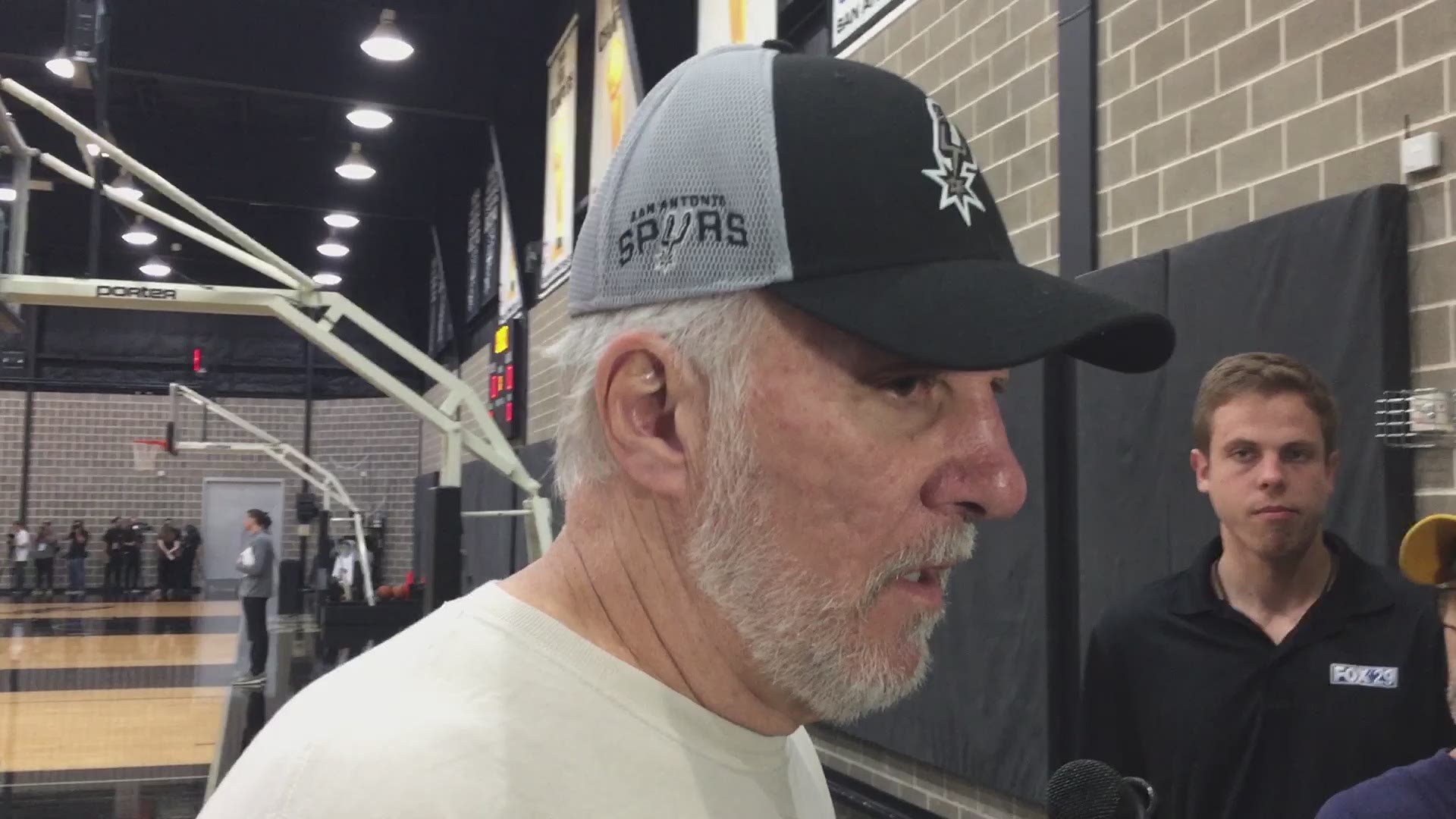Spurs head coach Gregg Popovich and point guard Patty Mills discuss the news that starter Dejounte Murray tore his ACL in Sunday's preseason game against the Houston Rockets.