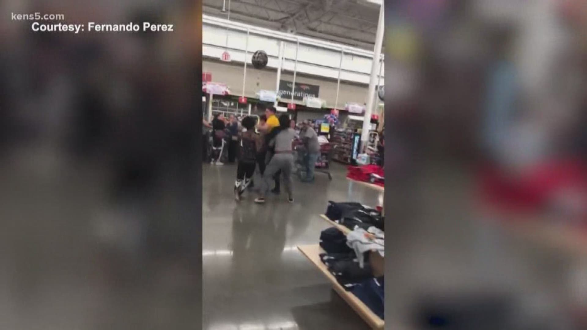 The video shows store employees trying to break up a fight between two groups of people at the southeast-side location.