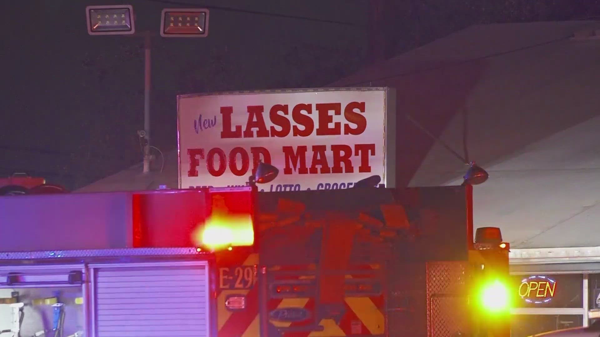 Firefighters battle a blaze at the Lasses Food Mart on the southeast side of town Friday evening.