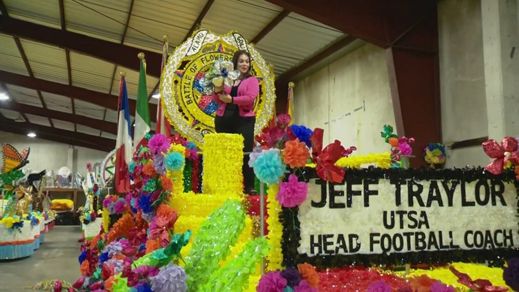 Where are Battle of Flowers floats stored before the parade?