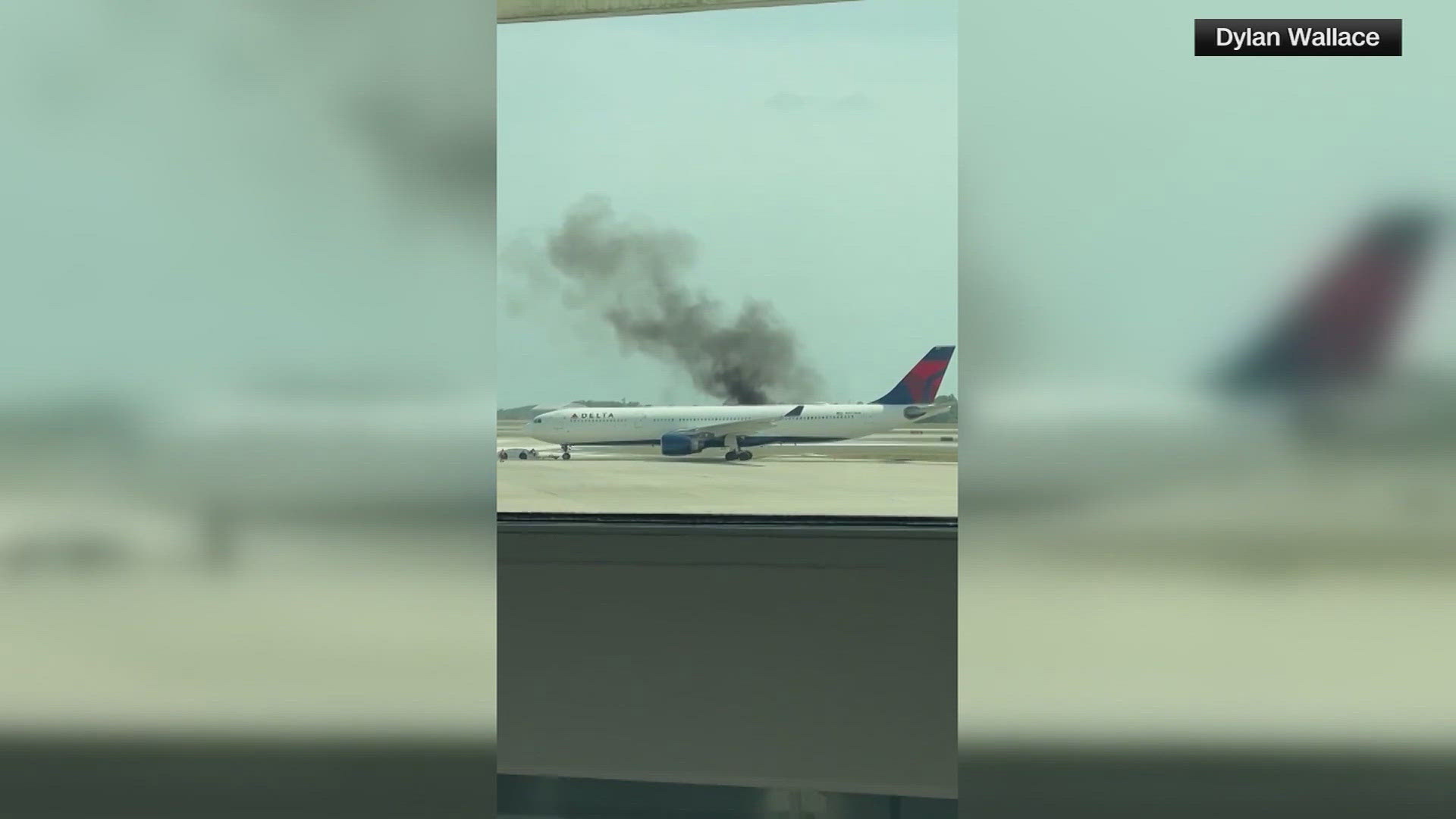 The FAA says the Atlanta-bound plane had just left its gate when flames were seen in an engine tailpipe.