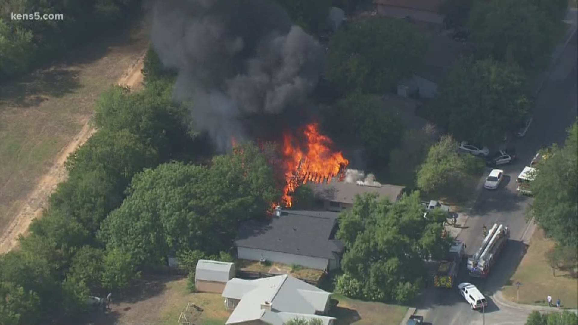 More than a dozen San Antonio Fire units made their way to a northeast San Antonio neighborhood Tuesday afternoon after a massive house fire erupted on the 4200 block of Misty Springs Drive, near Candlewood Park.