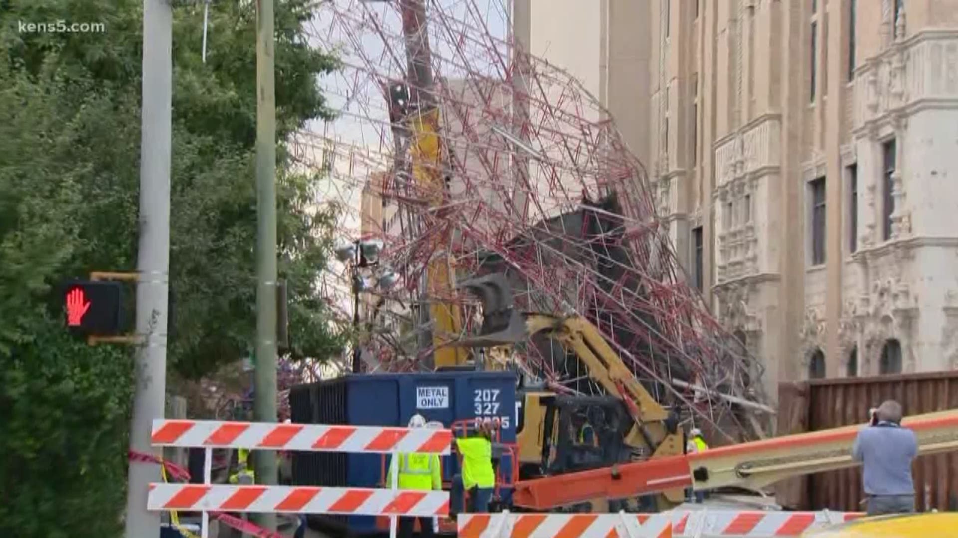 A downtown San Antonio street is still blocked by scaffolding brought down by sudden storms that moved through the city Thursday night.