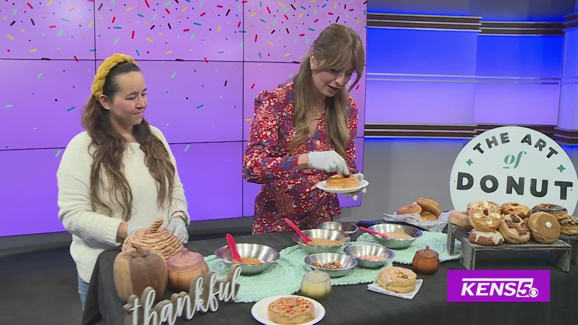 Andrea Aguirre with The Art of Donut helps Roma make some Fall-themed Donuts.