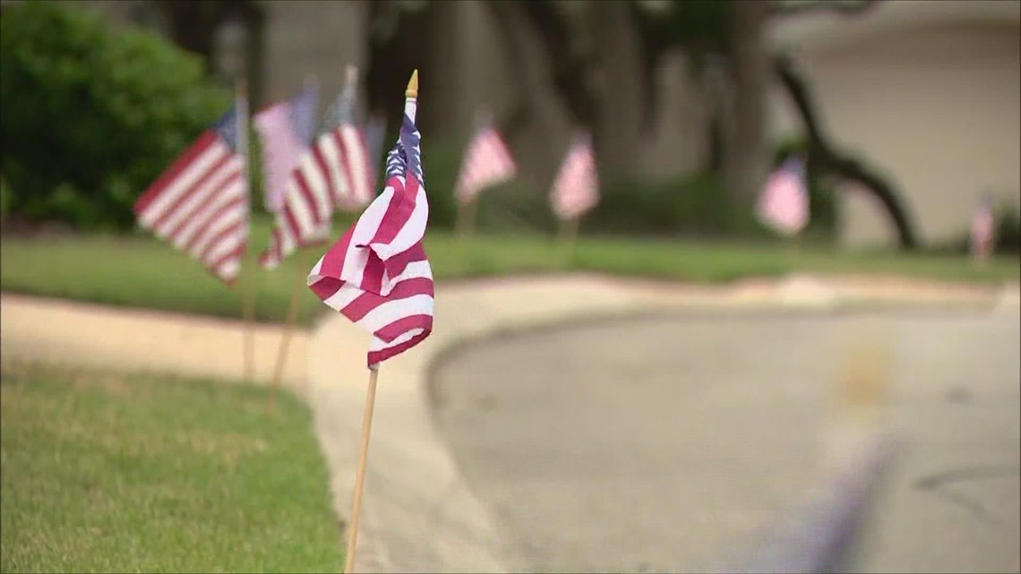 Volunteers lay 1,200 American flags across San Antonio neighborhood