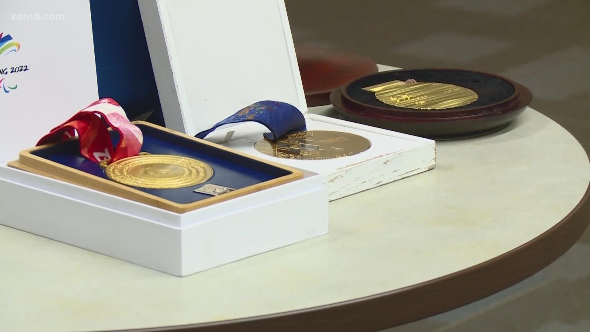 The suspect who broke into a Paralympian's car and took his medals is now behind bars and those medals were returned to their rightful owner.