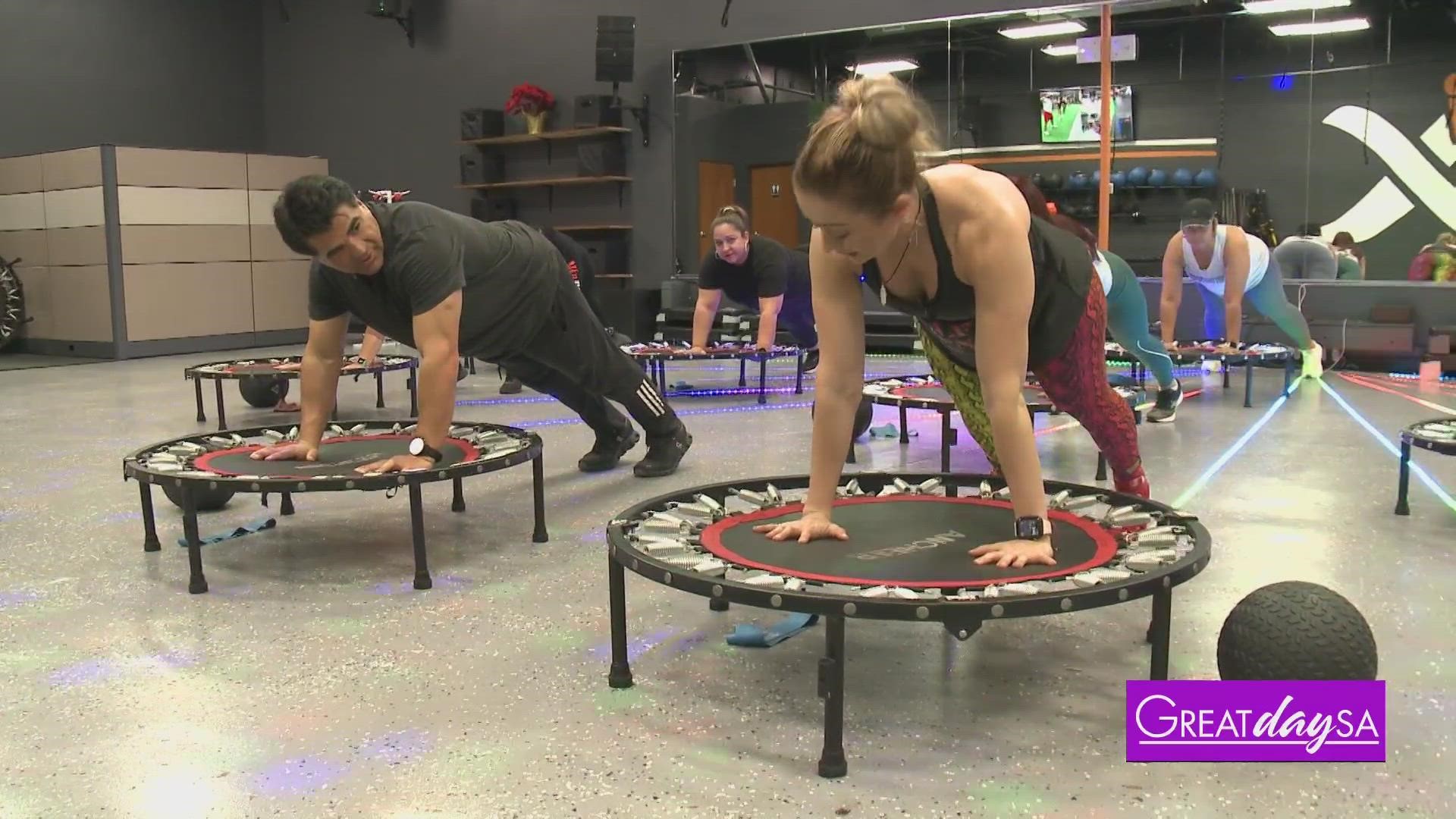 Alejandra with Alfa Fitness shows Paul how to strengthen his core using trampolines.