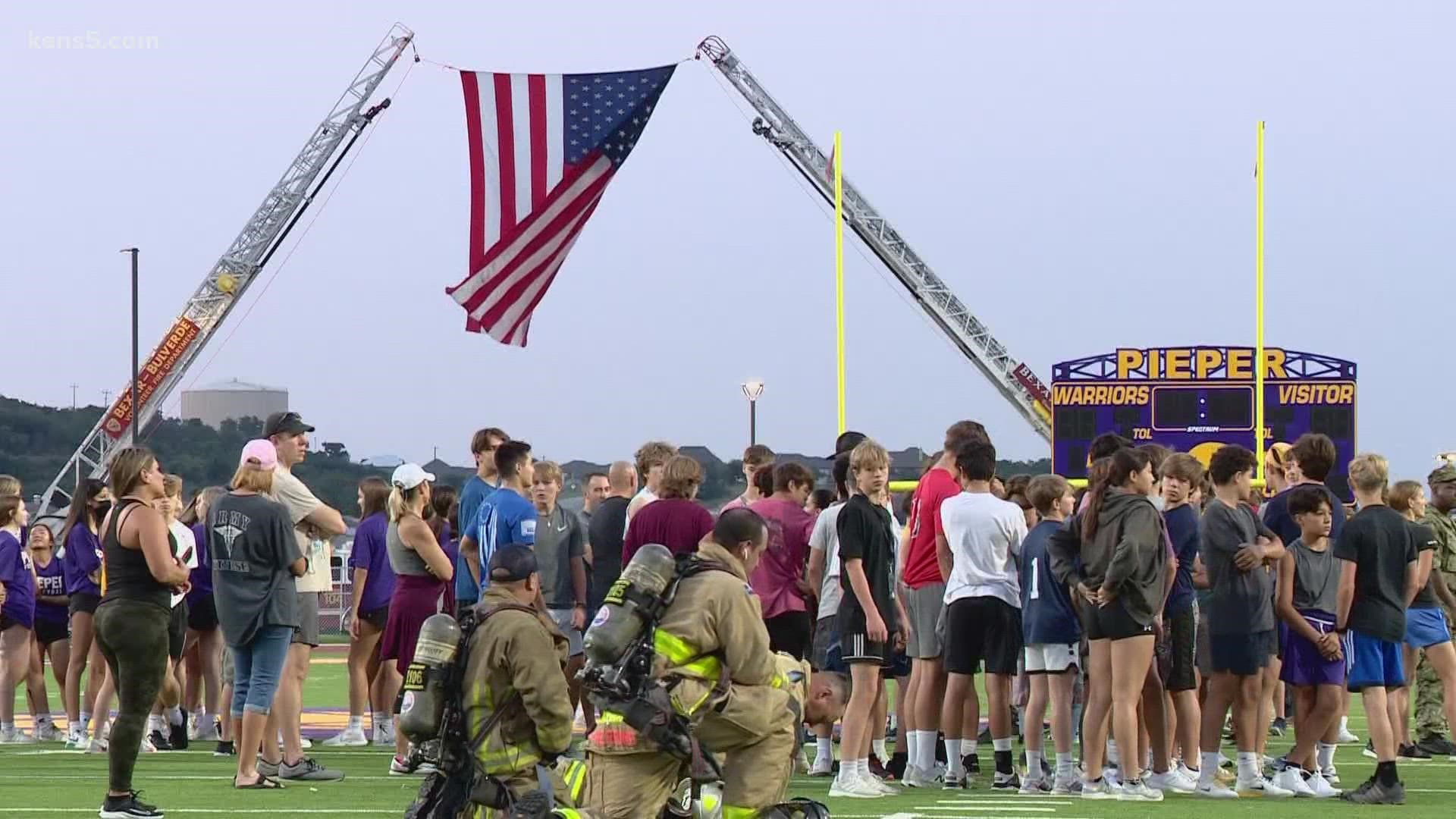 The new school in Comal Independent School District hosted the event at its stadium where firefighters, JROTC members and community members participated.