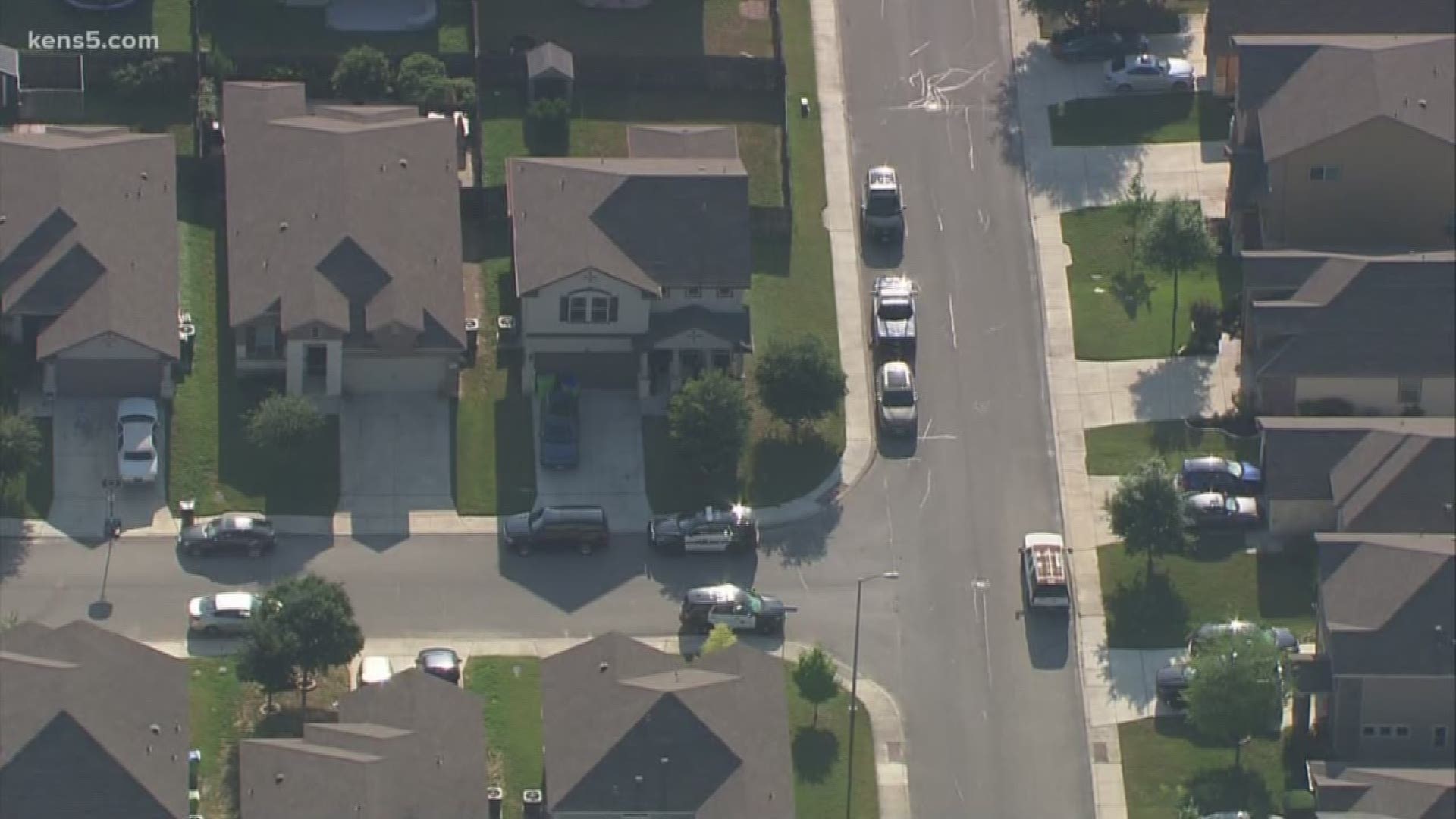 Police converge on west-side home that sources tell KENS 5 is connected to the deadly barbershop shooting and stabbing earlier today.