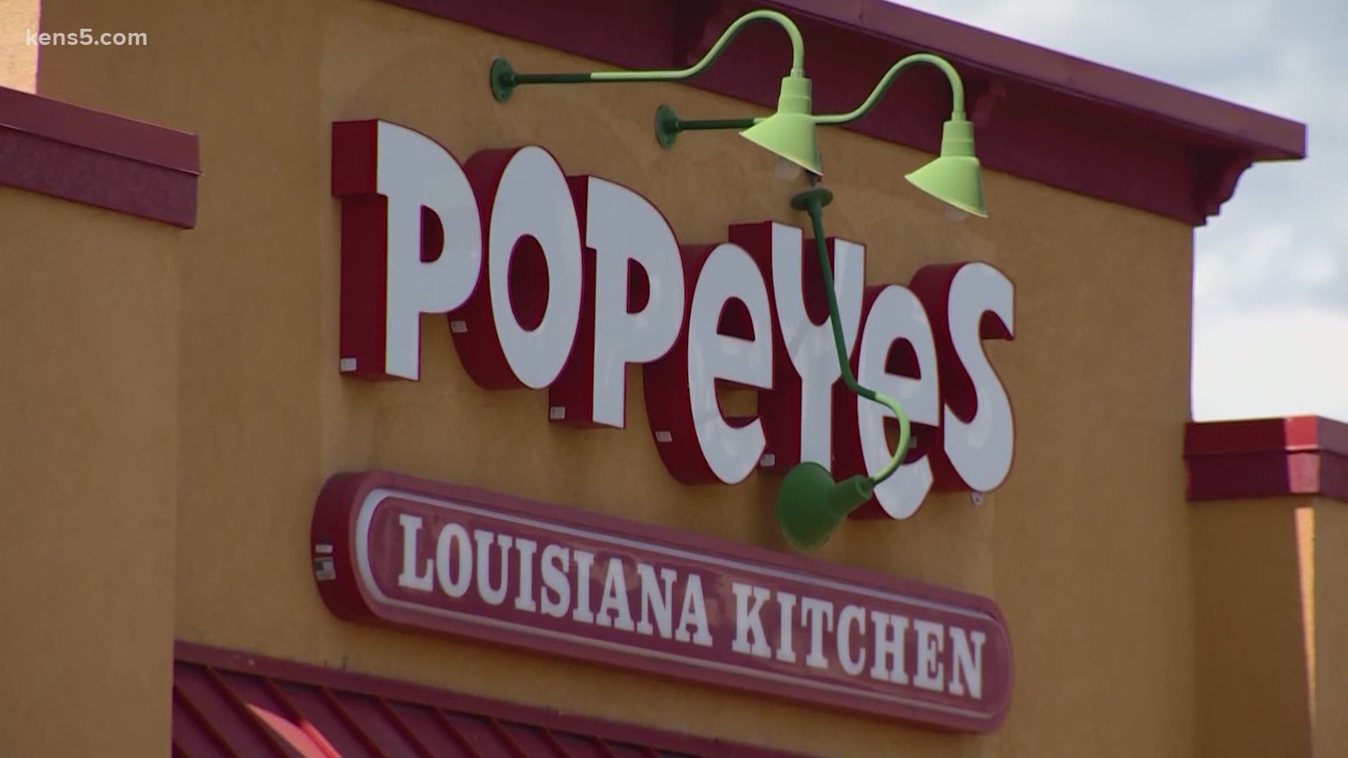 Popeyes Chicken said it terminated a San Antonio employee after a police officer said his meal came with a disparaging remark and saliva.