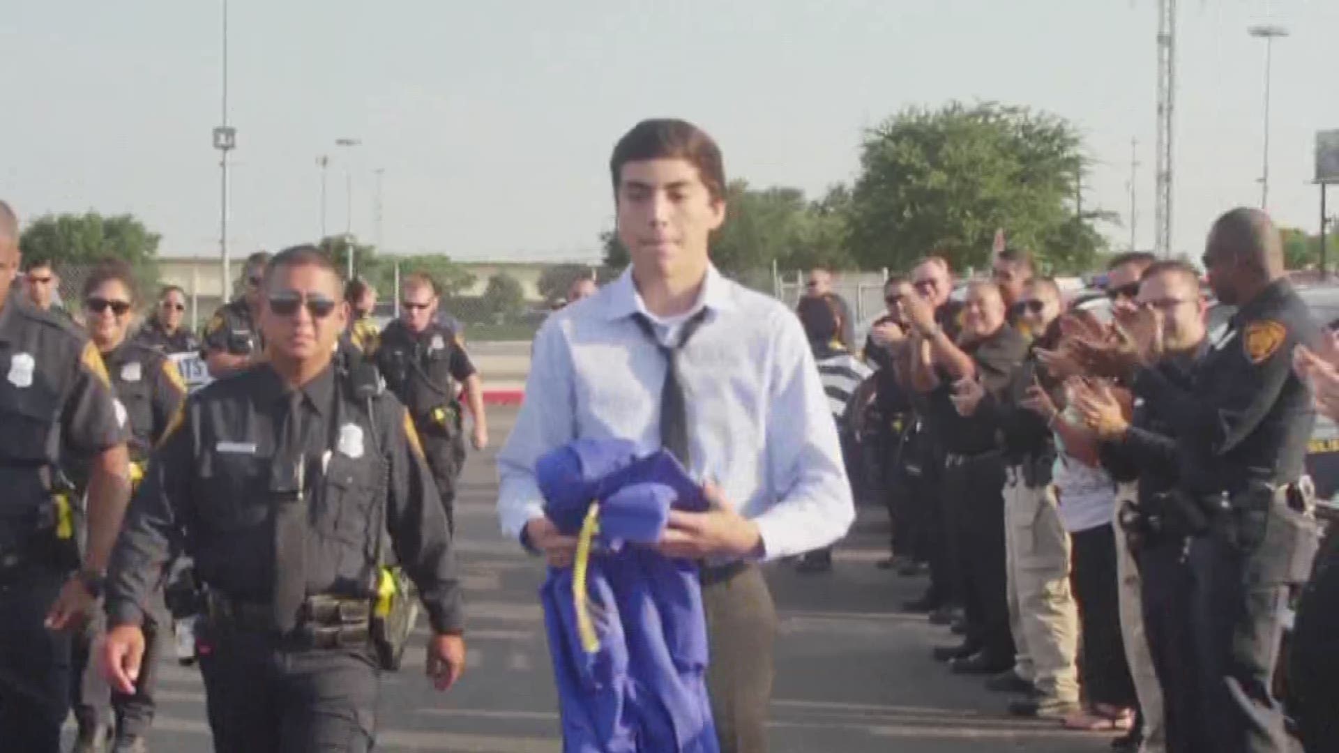 Officers escort graduate to honor fallen brother