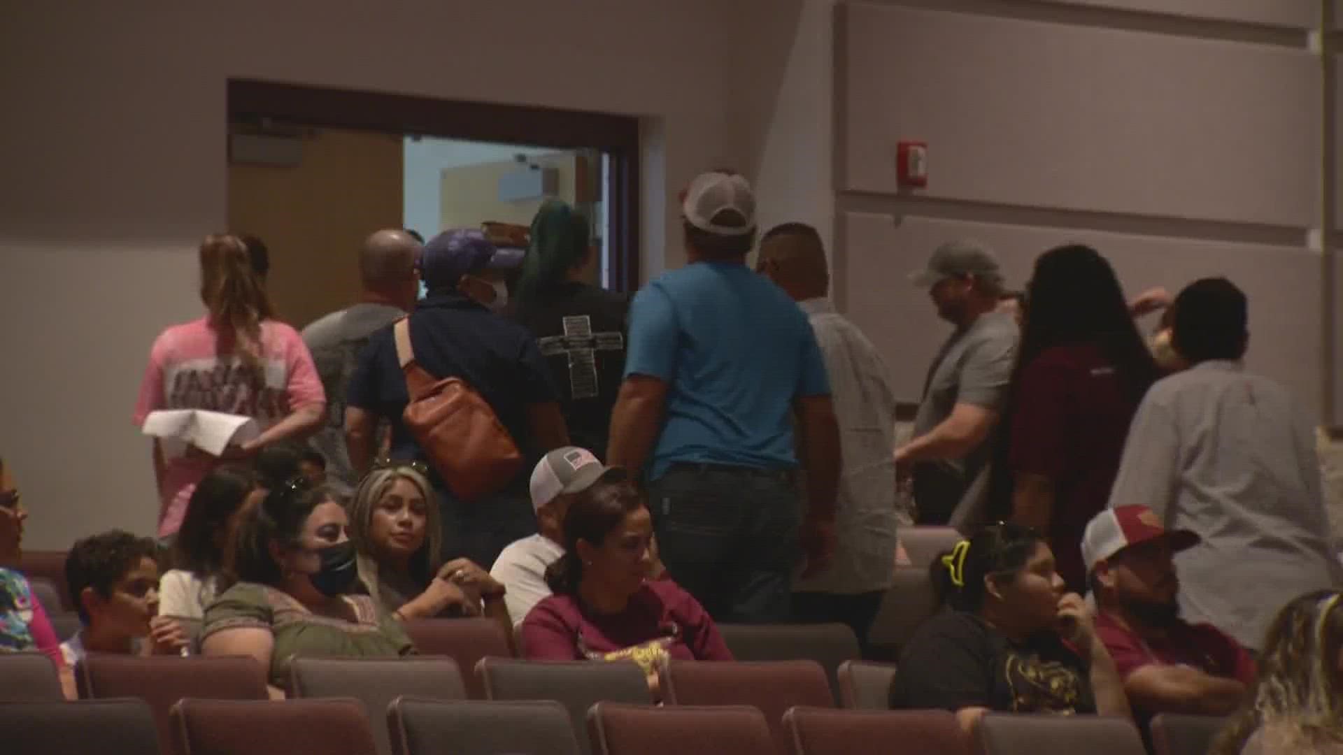 The dramatic moment came early in the meeting, and resulted in over a dozen attendees standing up and leaving the auditorium.