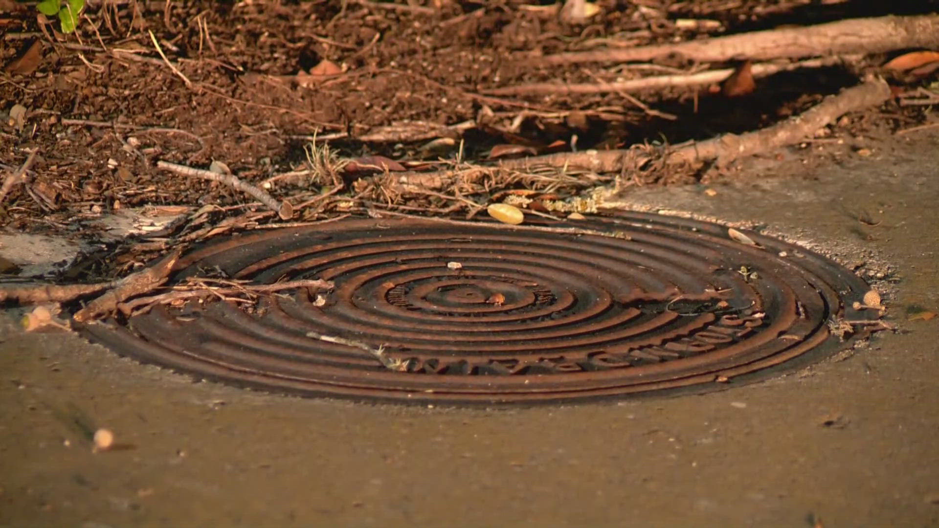 On Thursday, a woman found herself trapped in a 10-foot hole. Earlier this week, a grandfather nearly fell into a different uncovered manhole.