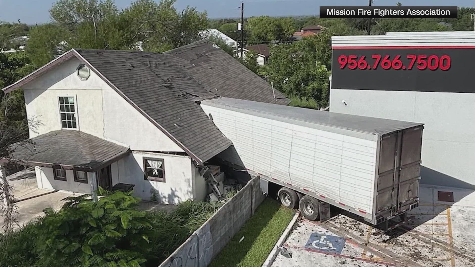 The 18-wheeler barreled off the highway and turned into a tire shop parking lot and crashed into a house.