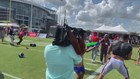 Texans engage in water gun fight with kids at practice