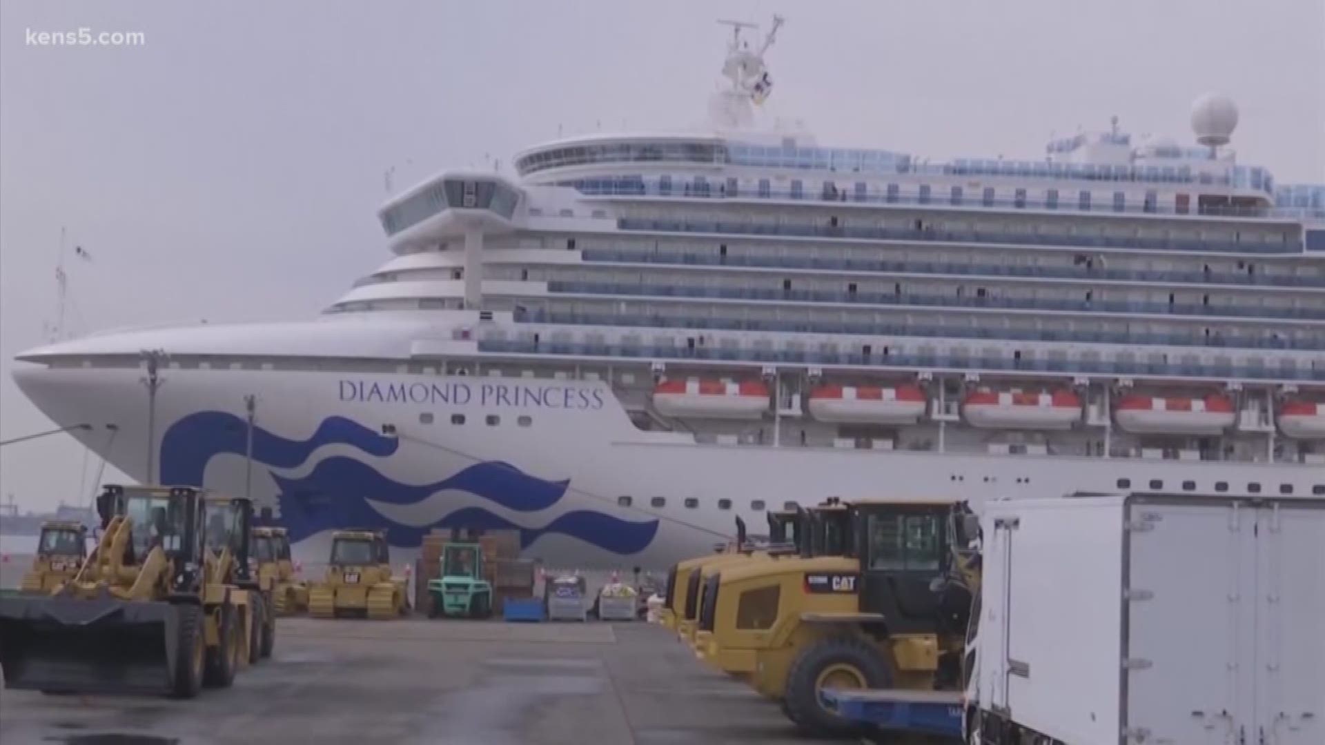 The ship, which is docked in Japan, has hundreds of American passengers.