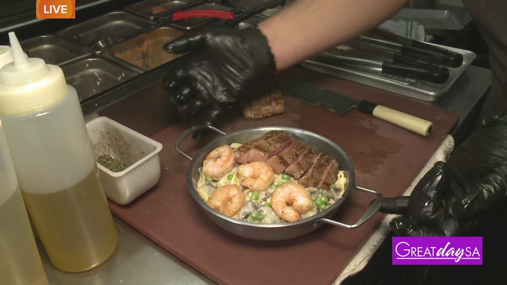 Multi-Skilled Journalist Justin Calderon helps make pasta at Mare e Monte Italian Restaurant.