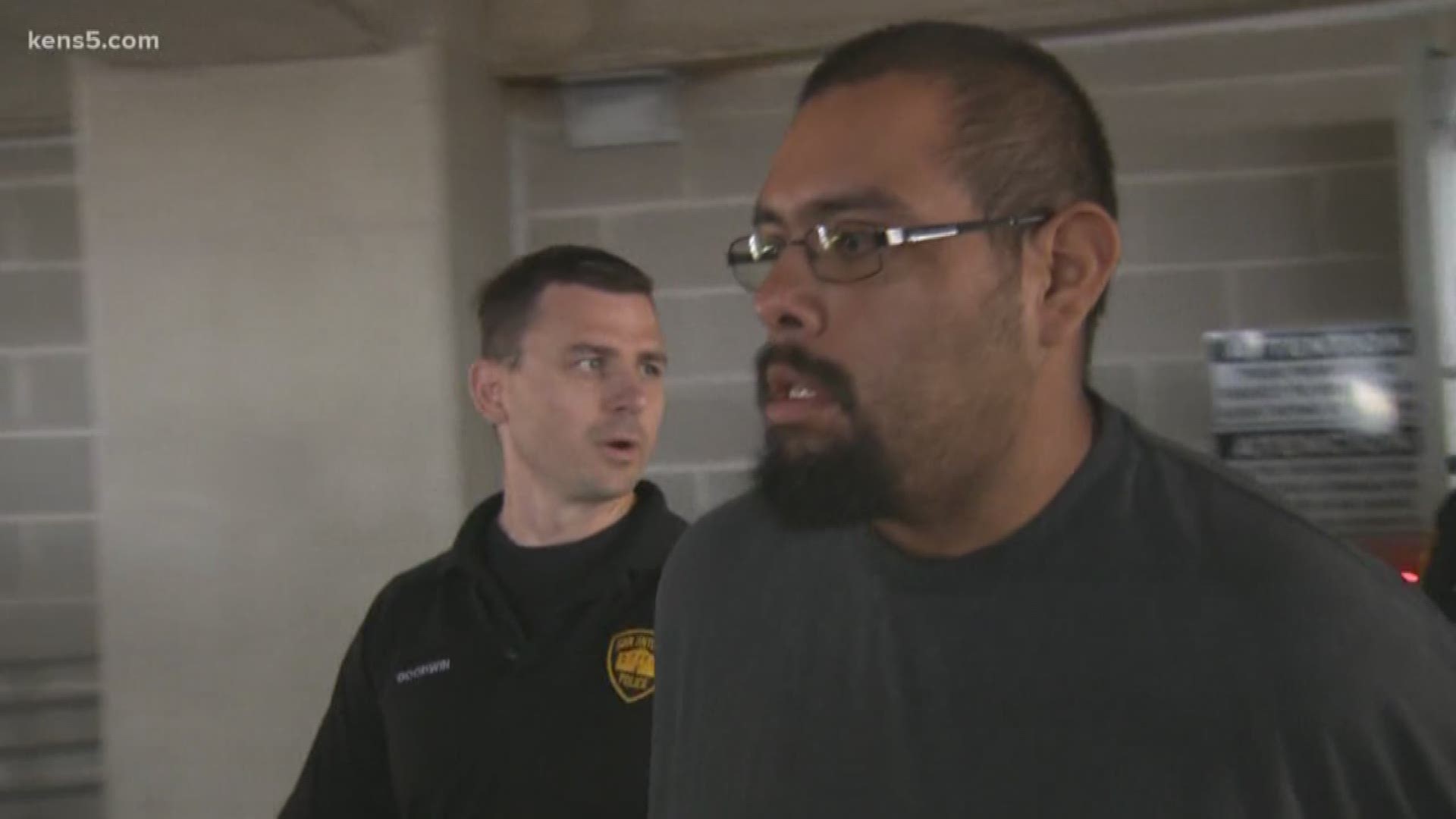 As Christopher Moreno, 37, got into the police car, he told reporters, "I'm innocent."