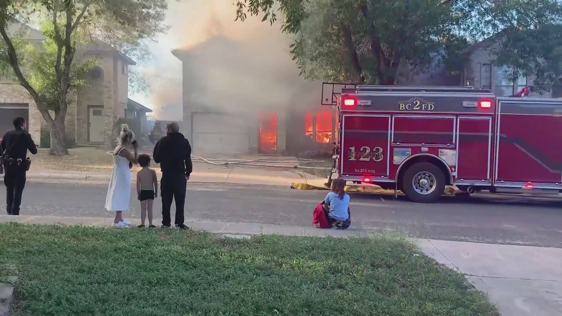 Smoke and flames filling the sky when one house was destroyed and two more were heavily damaged.