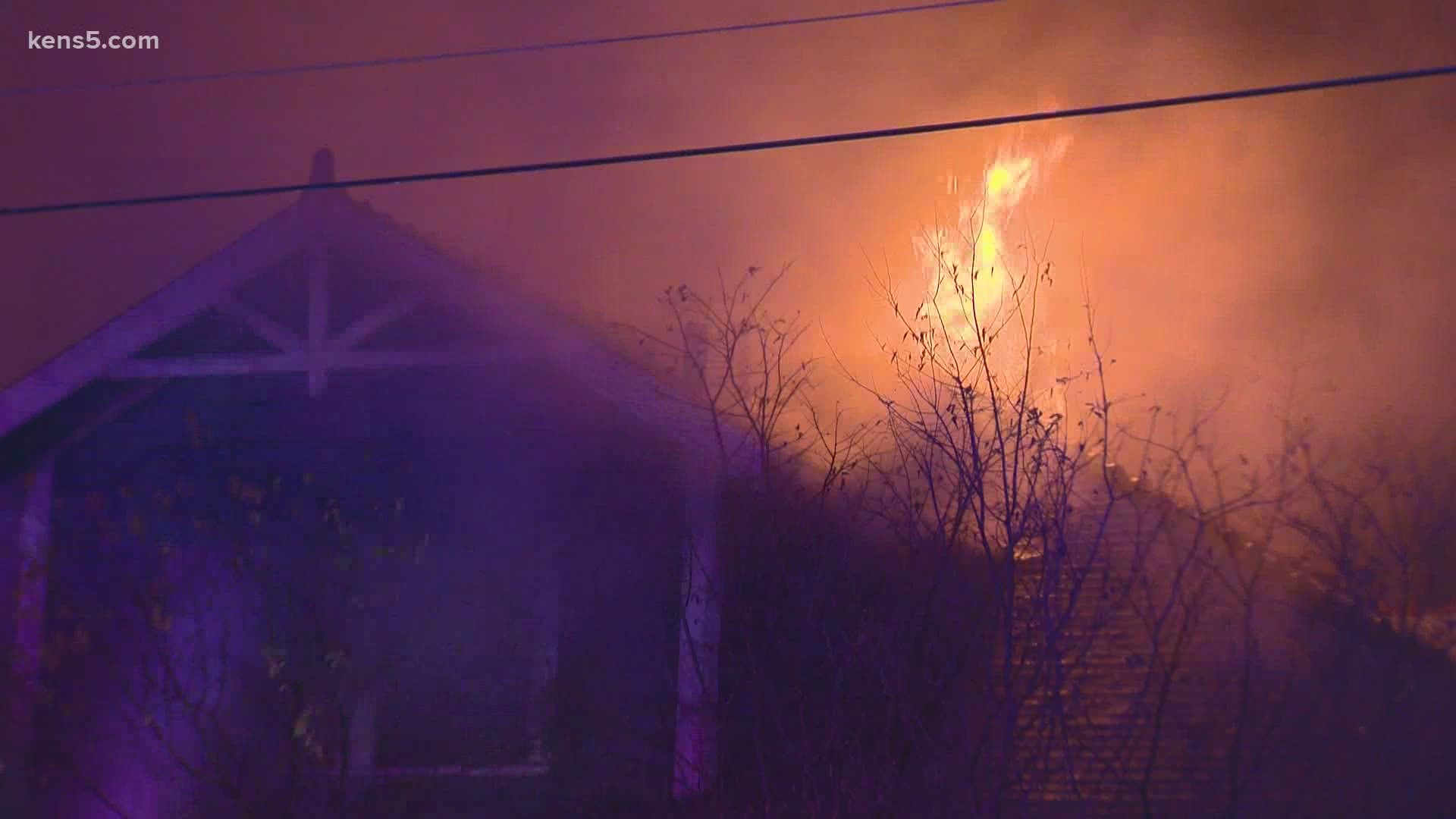 Structural collapses caused by the inferno caused firefighters to retreat and fight it from outside the building at the corner of West Russell and North Flores.