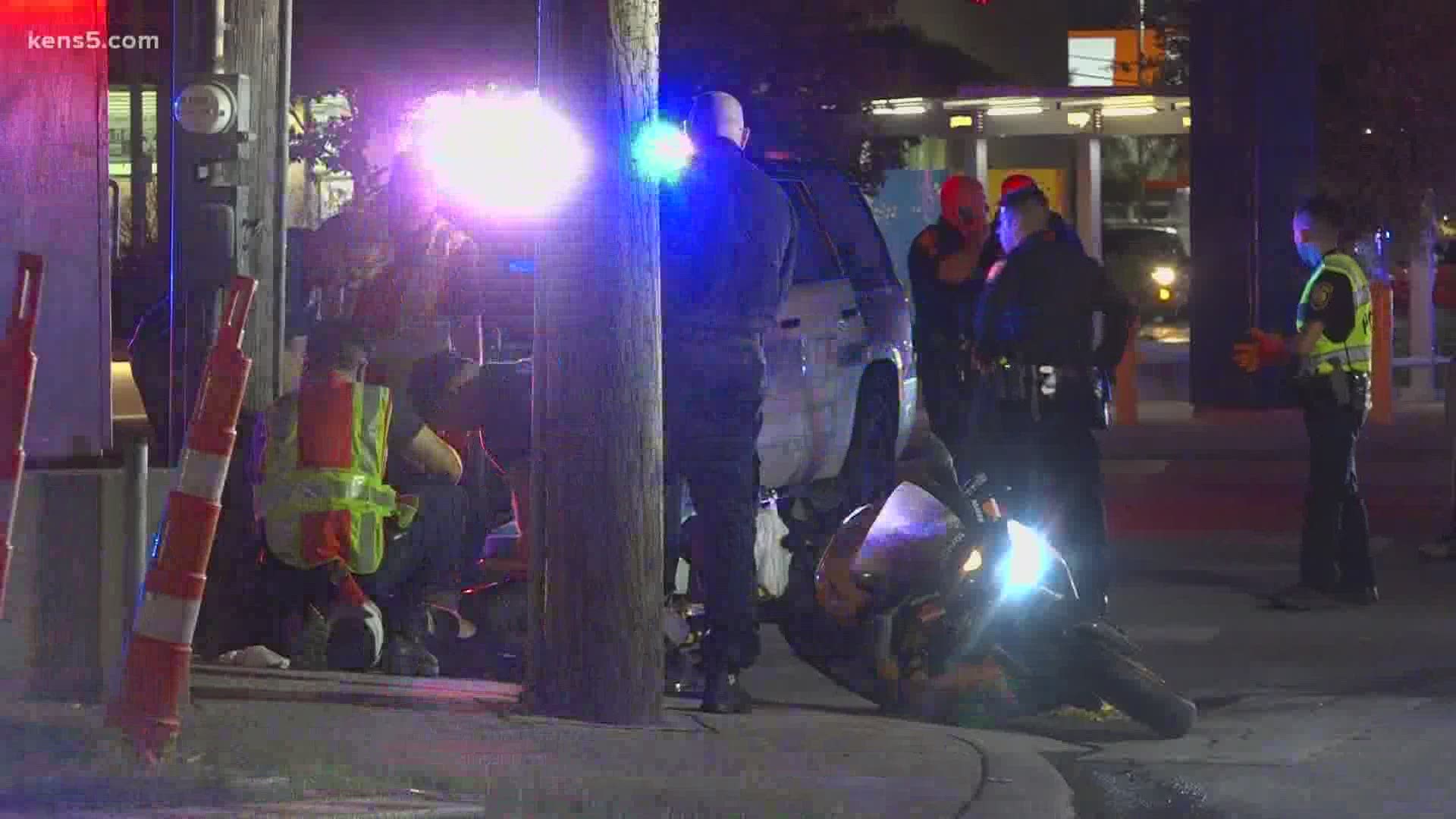 When the motorcycle driver ran a red light, he collided with the officer's cruiser.