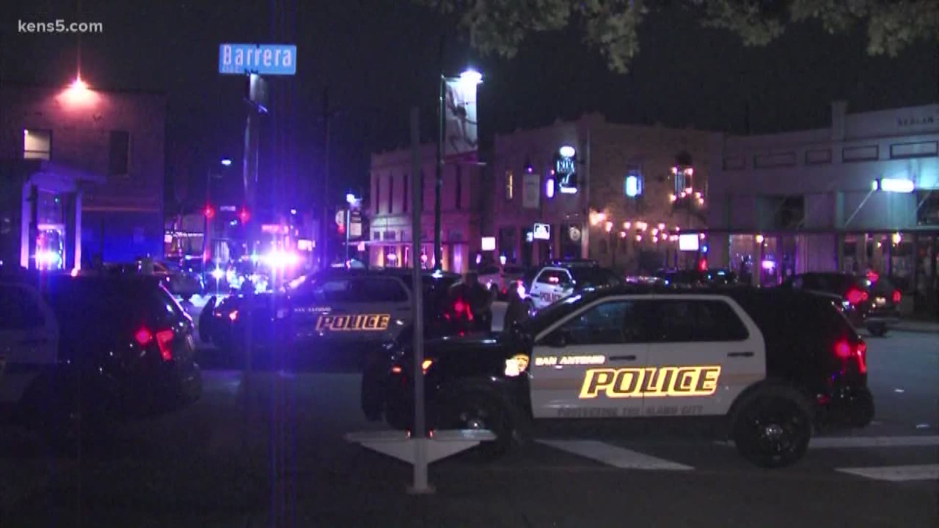 Police have arrested a man suspected of shooting two people outside a popular San Antonio bar overnight.