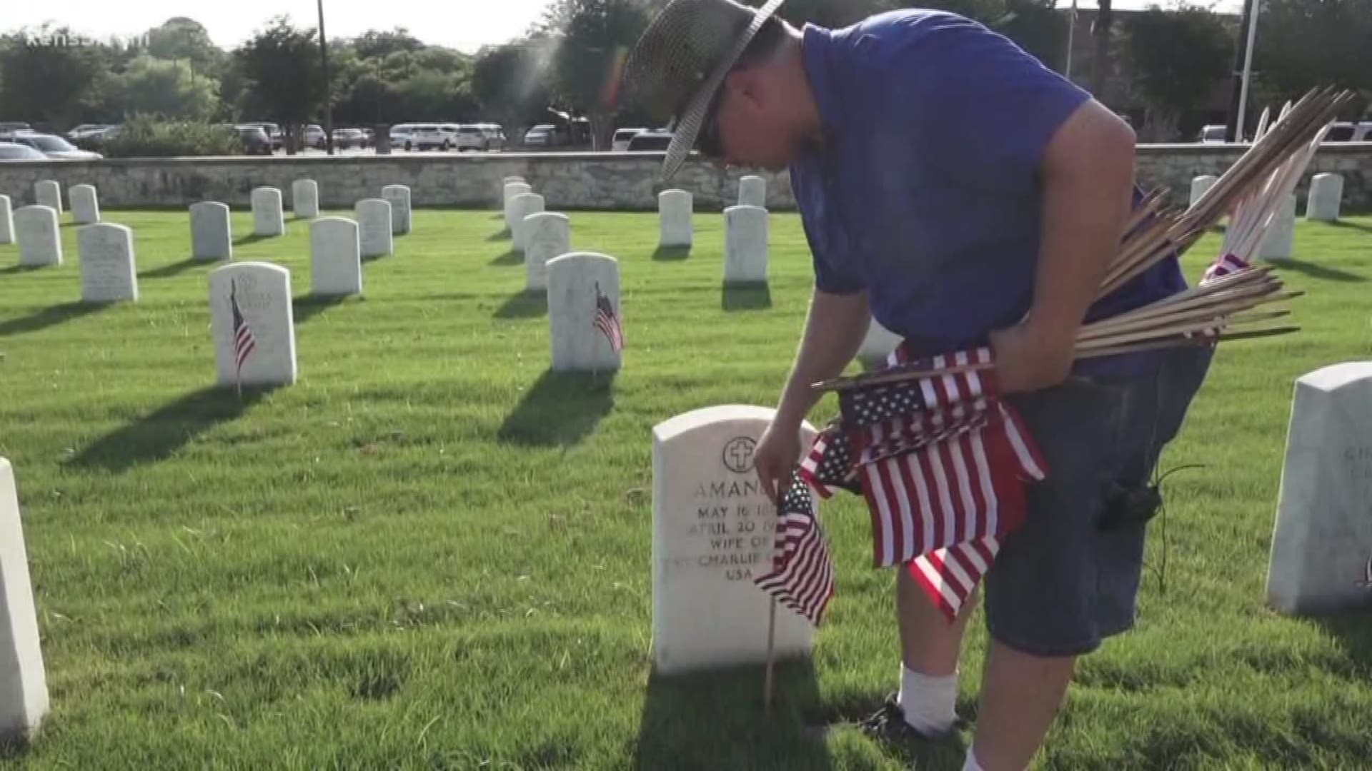 A flag at every gravesite was the goal of a group of volunteers at Ft. Sam Houston National Cemetery on Friday.