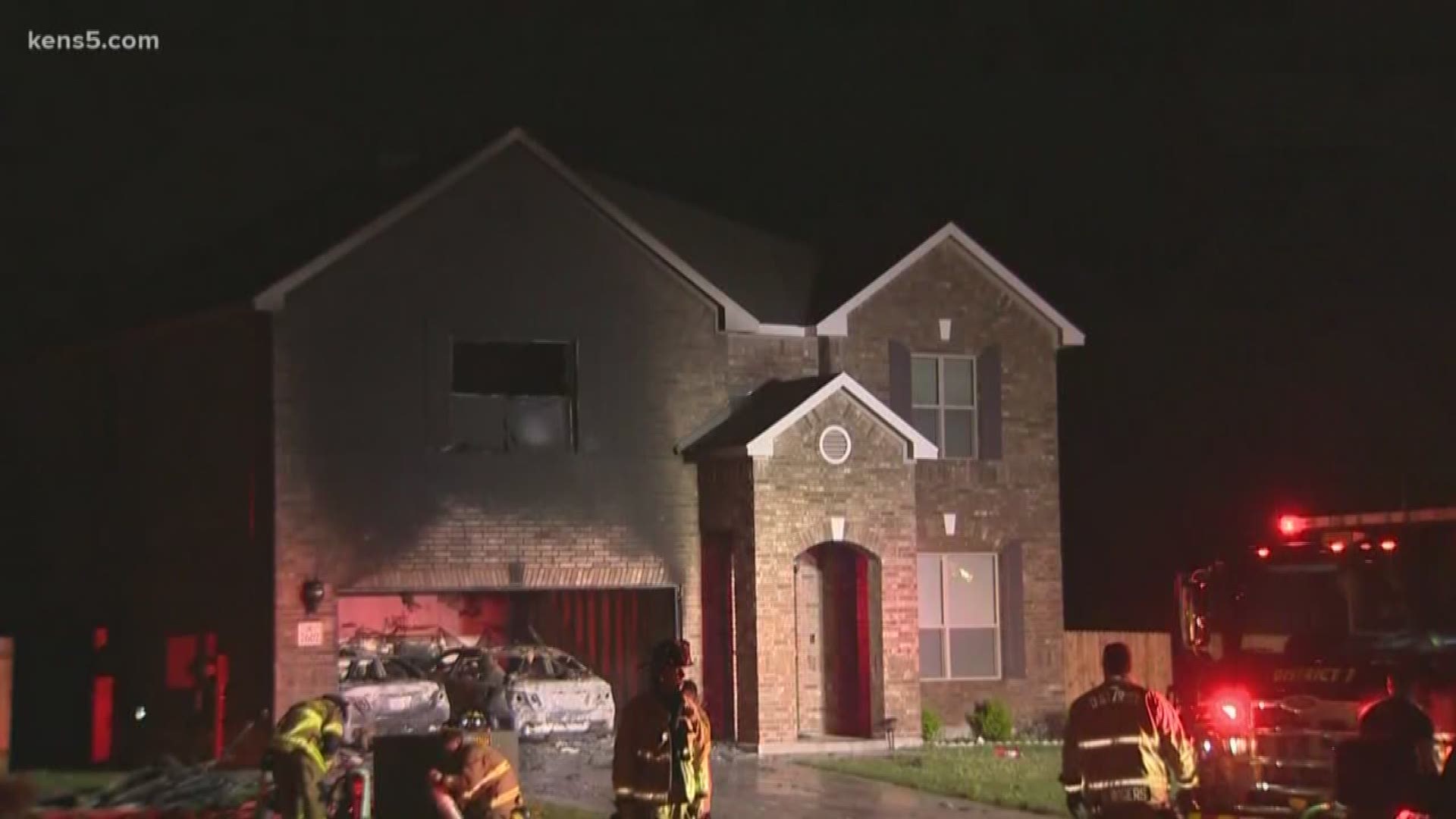 A garage fire sparked by an electric car spreads to home in west Bexar County.