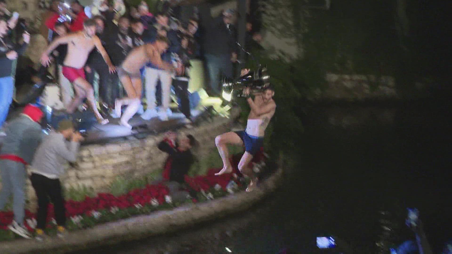 It was a chilly afternoon in downtown San Antonio, but that didn't stop several SAFC players from ripping off their clothes and leaping into the river.