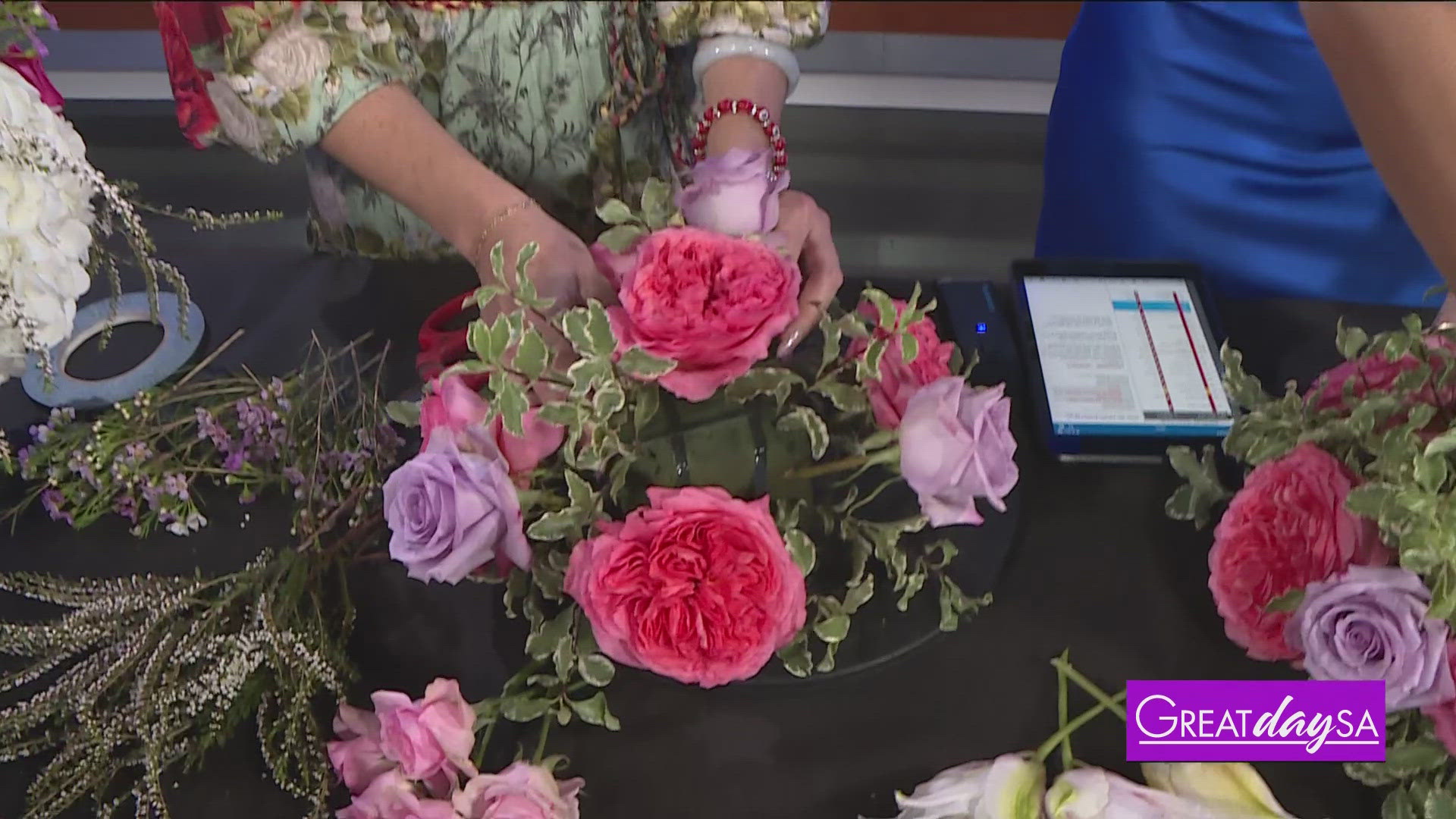 Roma helps make a flower centerpiece with Nicole's Floral Boutique & Events.