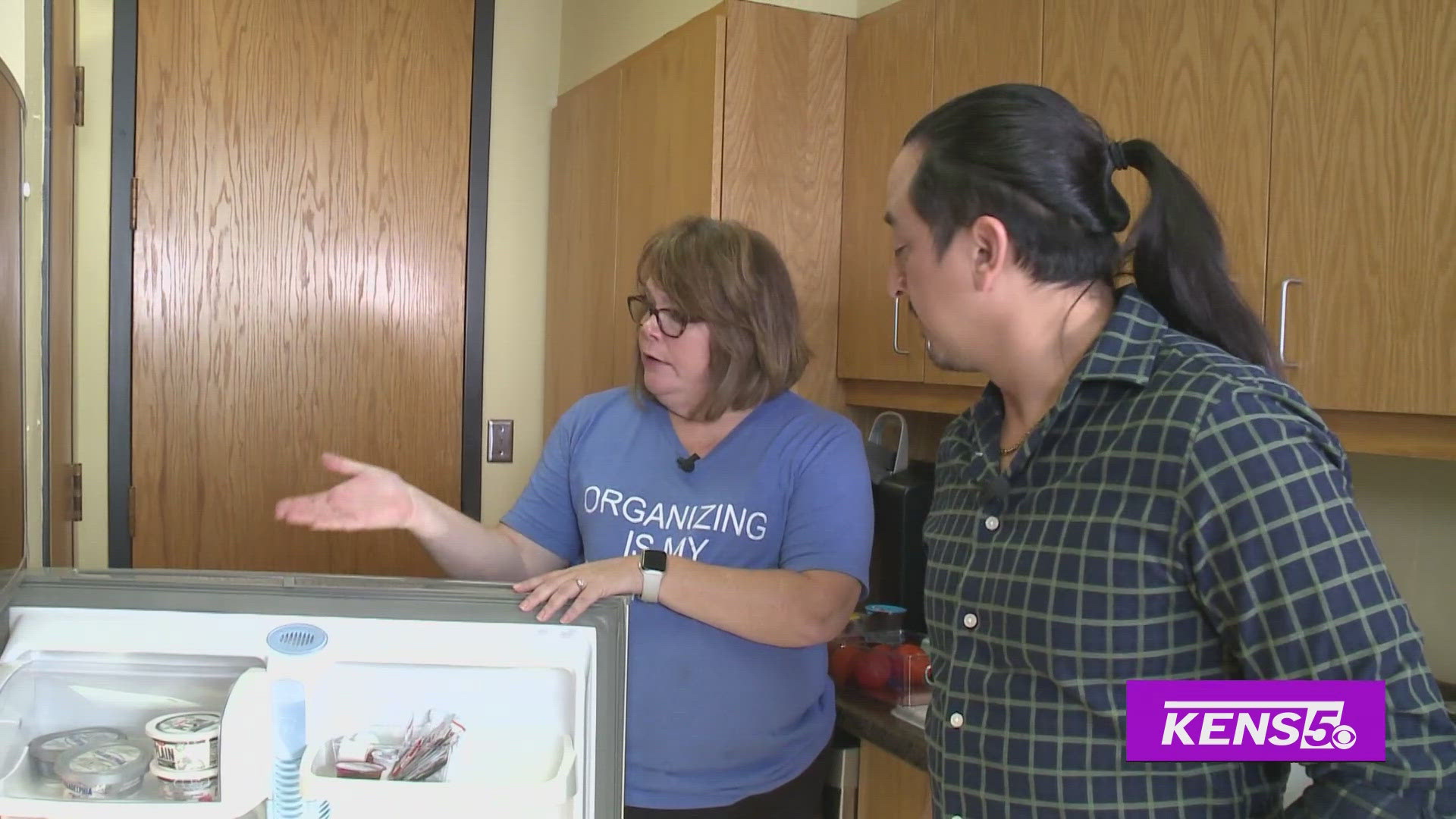 Multi-Skilled Journalist Justin Calderon gets fridge cleaning tips from Heather Clark with Alamo Organizers. 