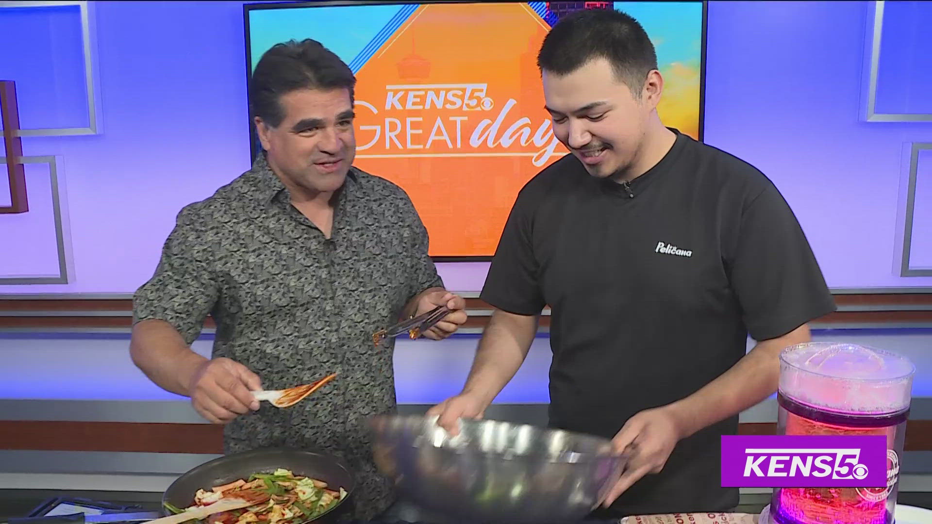 Paul helps make some Korean Fried Chicken with Juan Arenas from Pelicana Chicken.