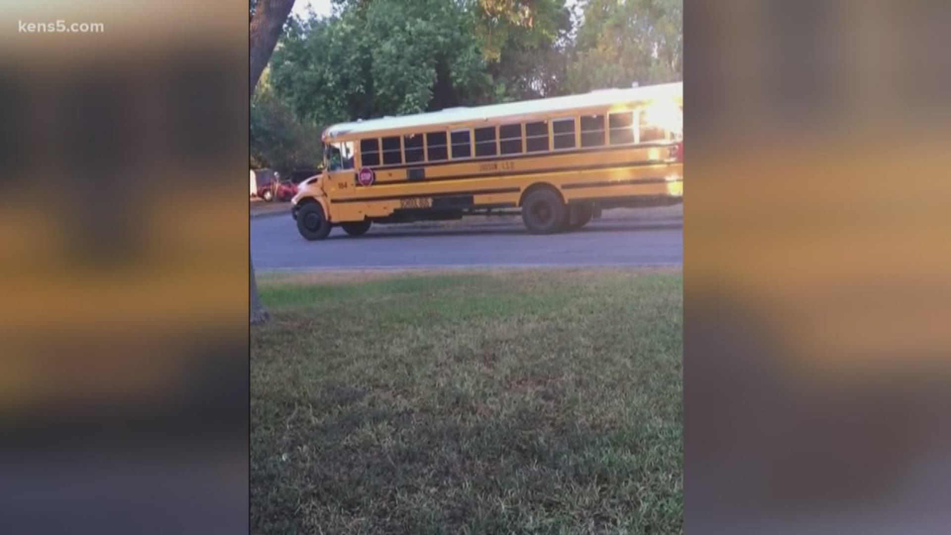 The video obtained by KENS 5 shows a bus driver from Judson ISD failing to use proper precautions while students board the bus.