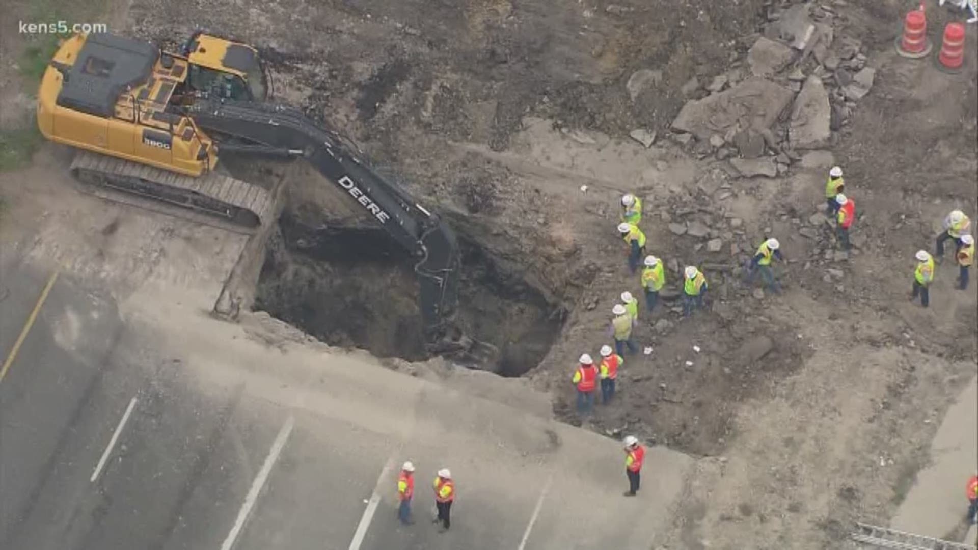 The westbound lanes and the frontage road of Highway 90 were shut down when a massive sinkhole appeared Tuesday morning. The frontage road was reopened early Wednesday morning.