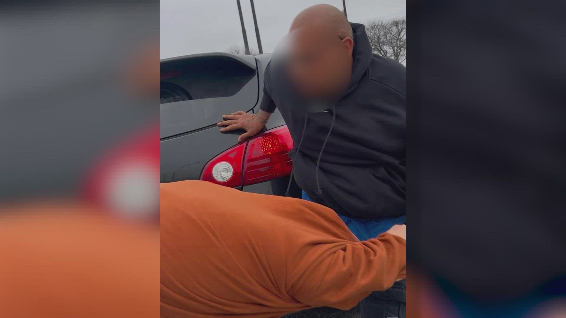 The woman says the driver cut her off three times but then two passengers from that car got out – and the situation escalated.