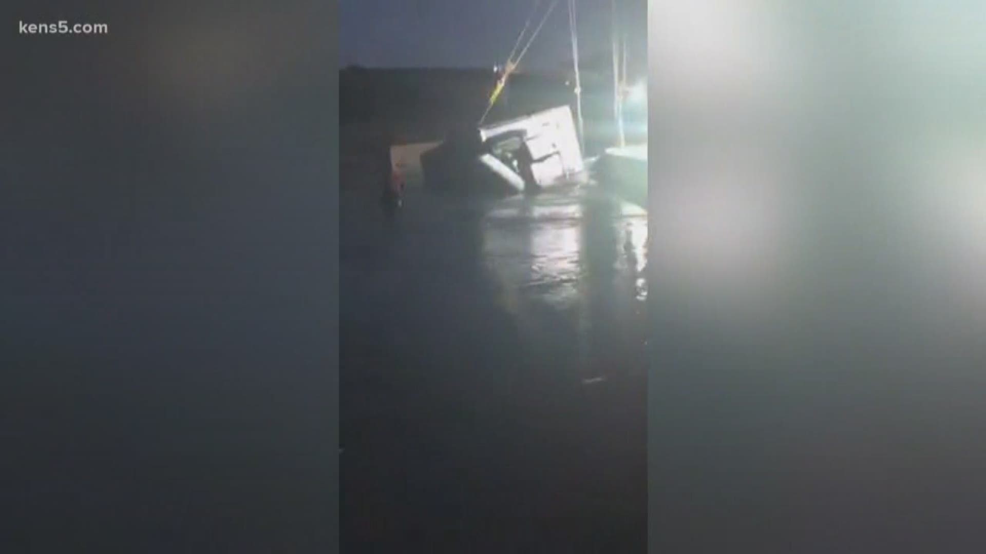 Video shared to the Junction Eagle Facebook page shows an overturned truck hauling 42,000 pounds of avocados being pulled out of the Llano River. No injuries were reported.