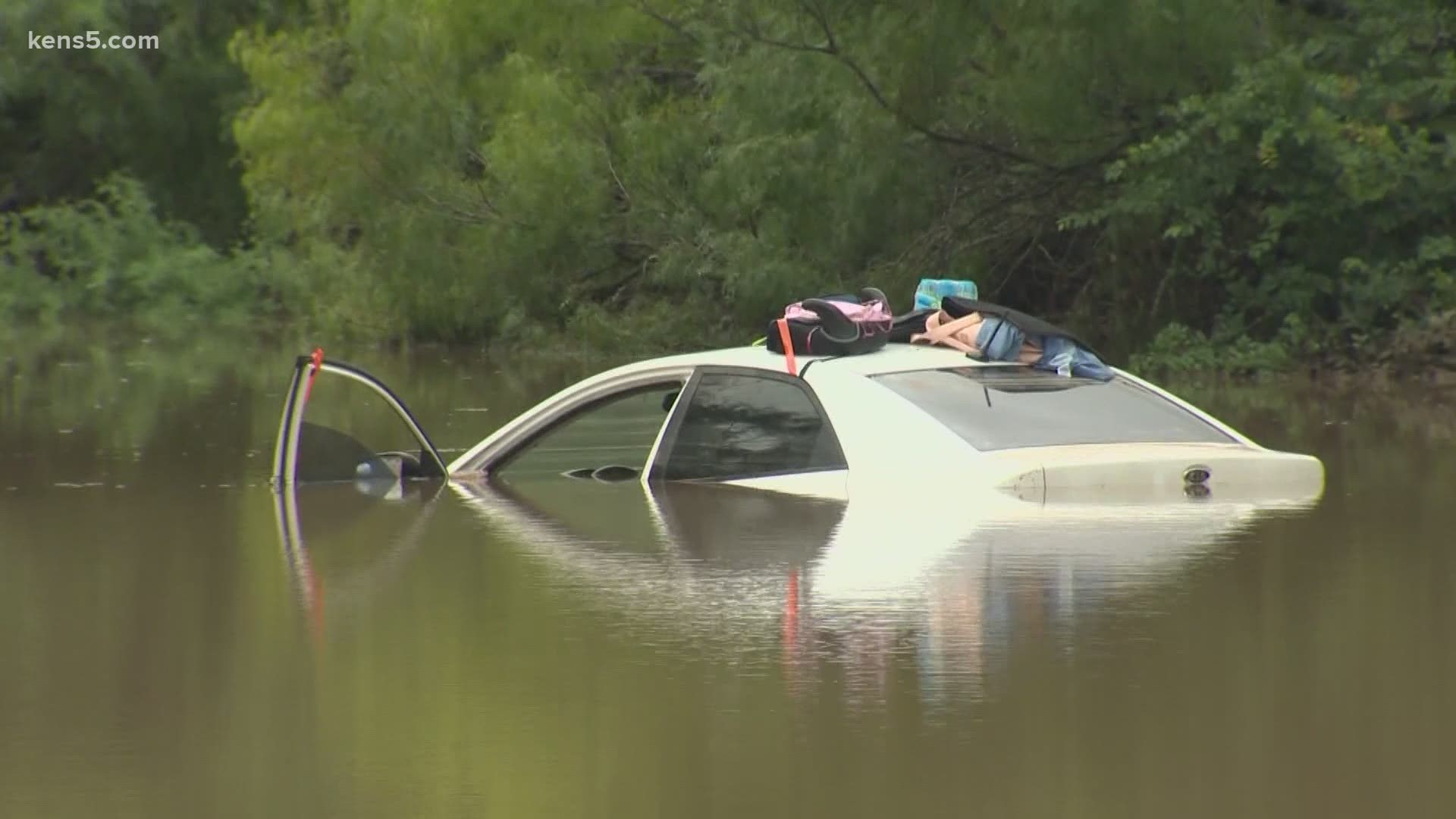 The San Antonio Fire Department launched a raft to check on people in flooded homes.
