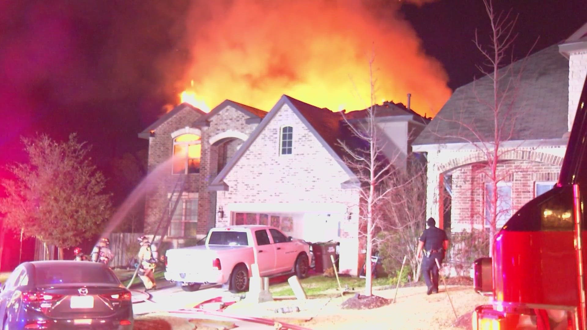 The fire was blowing throught the roof of the home when crews arrived.